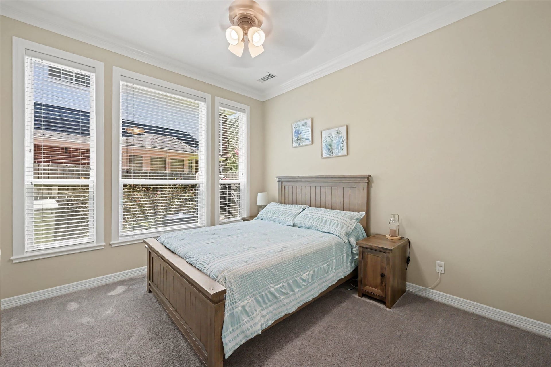 2907 Winding Shore Lane, Katy, TX 77450 Additional downstairs bedroom featuring a large walk-in closet and convenient access to a full bathroom, offering comfort and privacy for guests or family members.