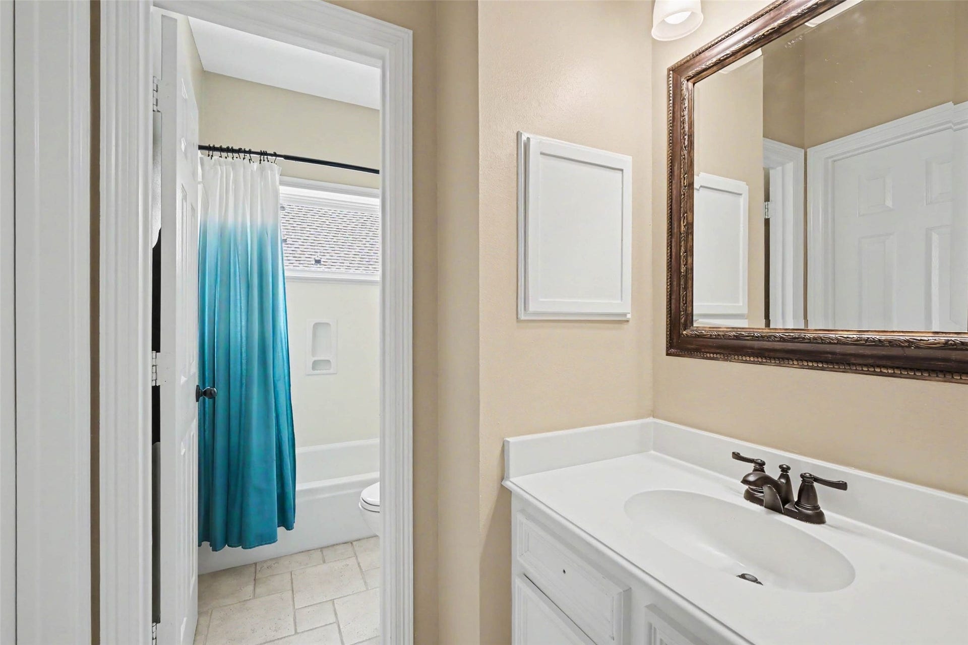2907 Winding Shore Lane, Katy, TX 77450 Beautifully designed bathroom featuring a private enclosed shower area with its own door, elegant vanity, and thoughtfully arranged finishes. This functional layout provides comfort, privacy, and a relaxing retreat.