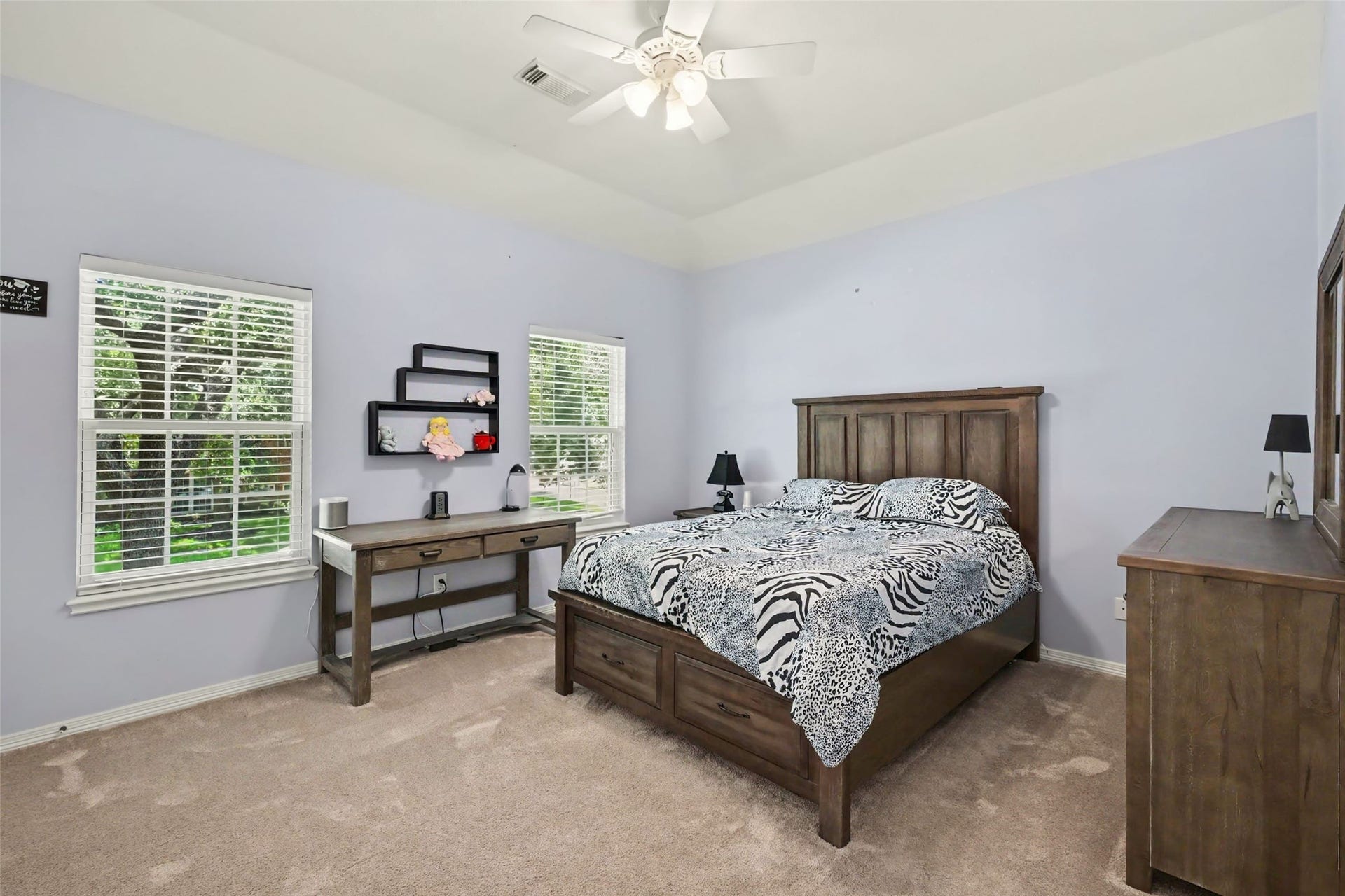2907 Winding Shore Lane, Katy, TX 77450 Bright and spacious bedroom featuring two windows that fill the room with natural light, creating a warm, comfortable, and inviting private retreat.