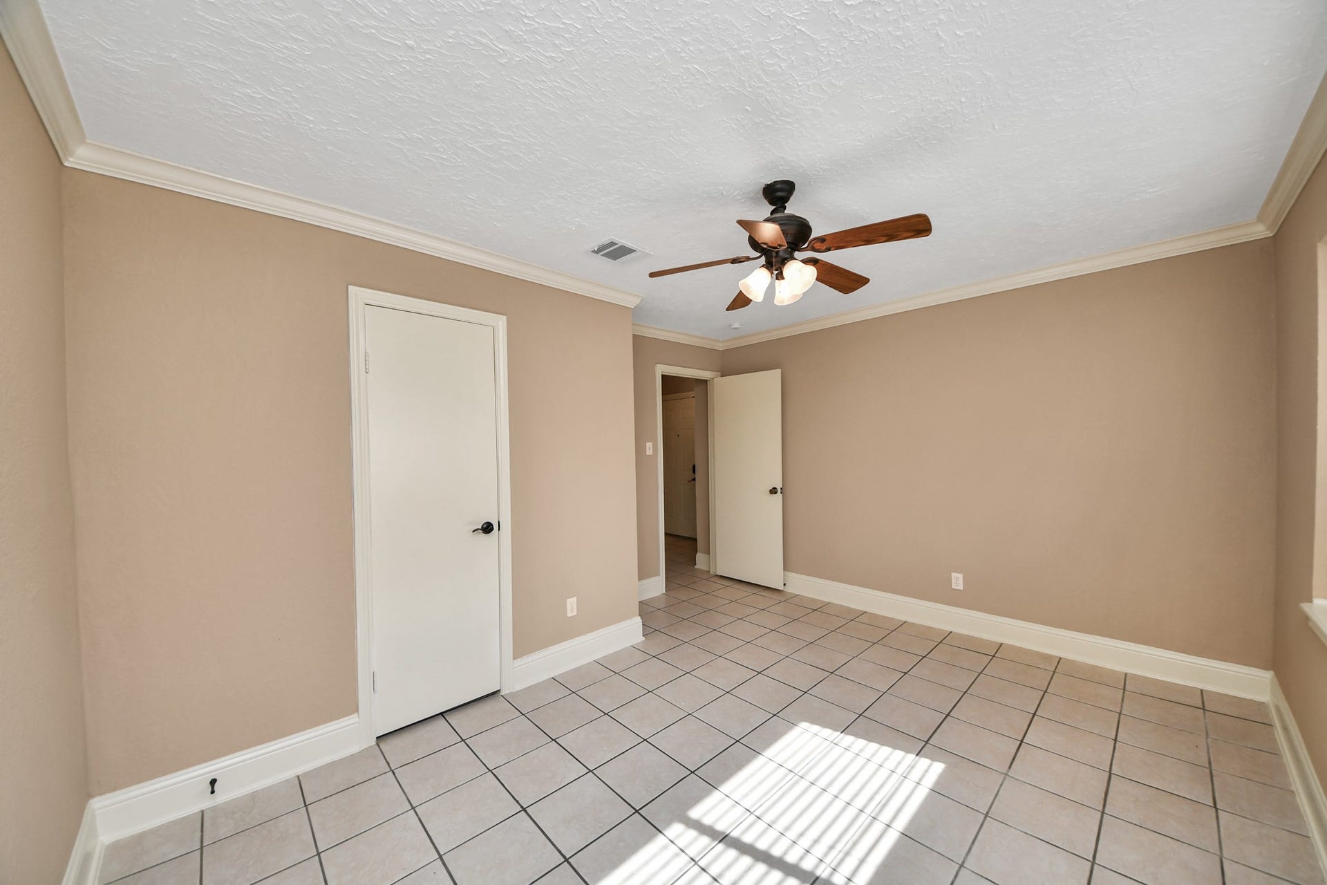 935 Grand Junction Drive, Katy, TX 77450 Conveniently situated on the lower level, it offers added privacy and separation from the upstairs primary suite!