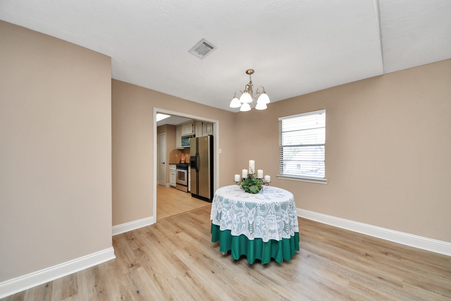 935 Grand Junction Drive, Katy, TX 77450 Conveniently situated just steps from the kitchen, this dining space makes serving meals and entertaining guests effortless.