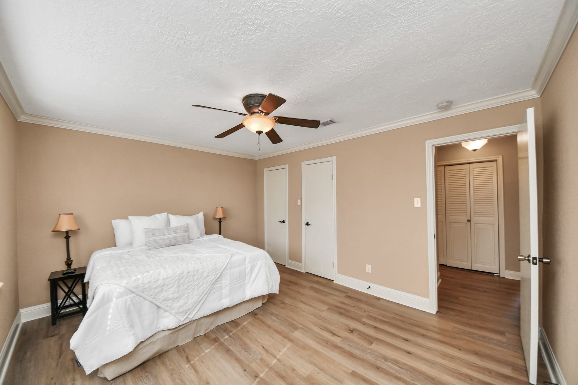 935 Grand Junction Drive, Katy, TX 77450 Retreat to this generously sized upper-level primary bedroom, where comfort meets understated style.