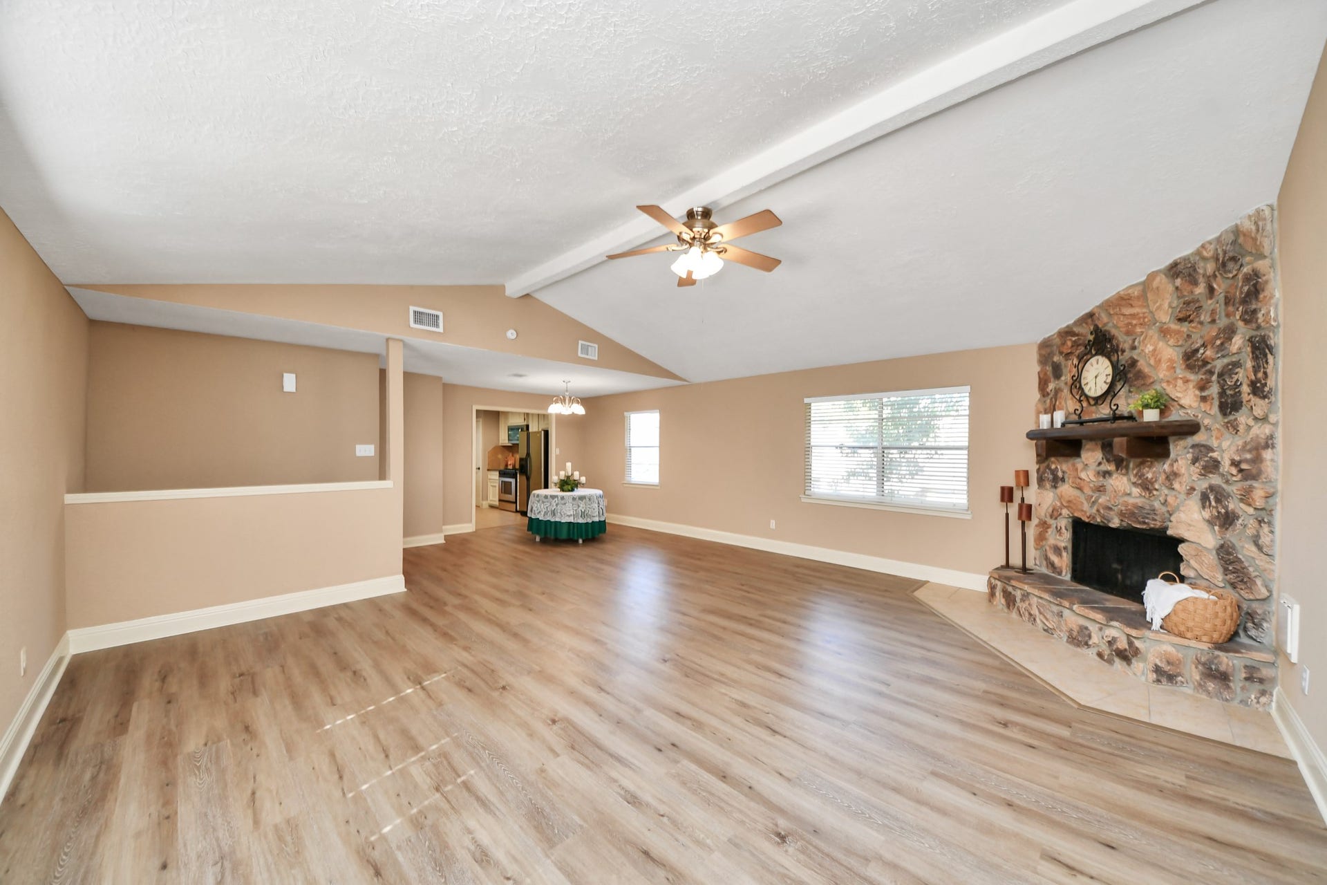 935 Grand Junction Drive, Katy, TX 77450 With generous dimensions and attractive wood-look flooring, this room provides the perfect canvas for creating a personalized living environment.