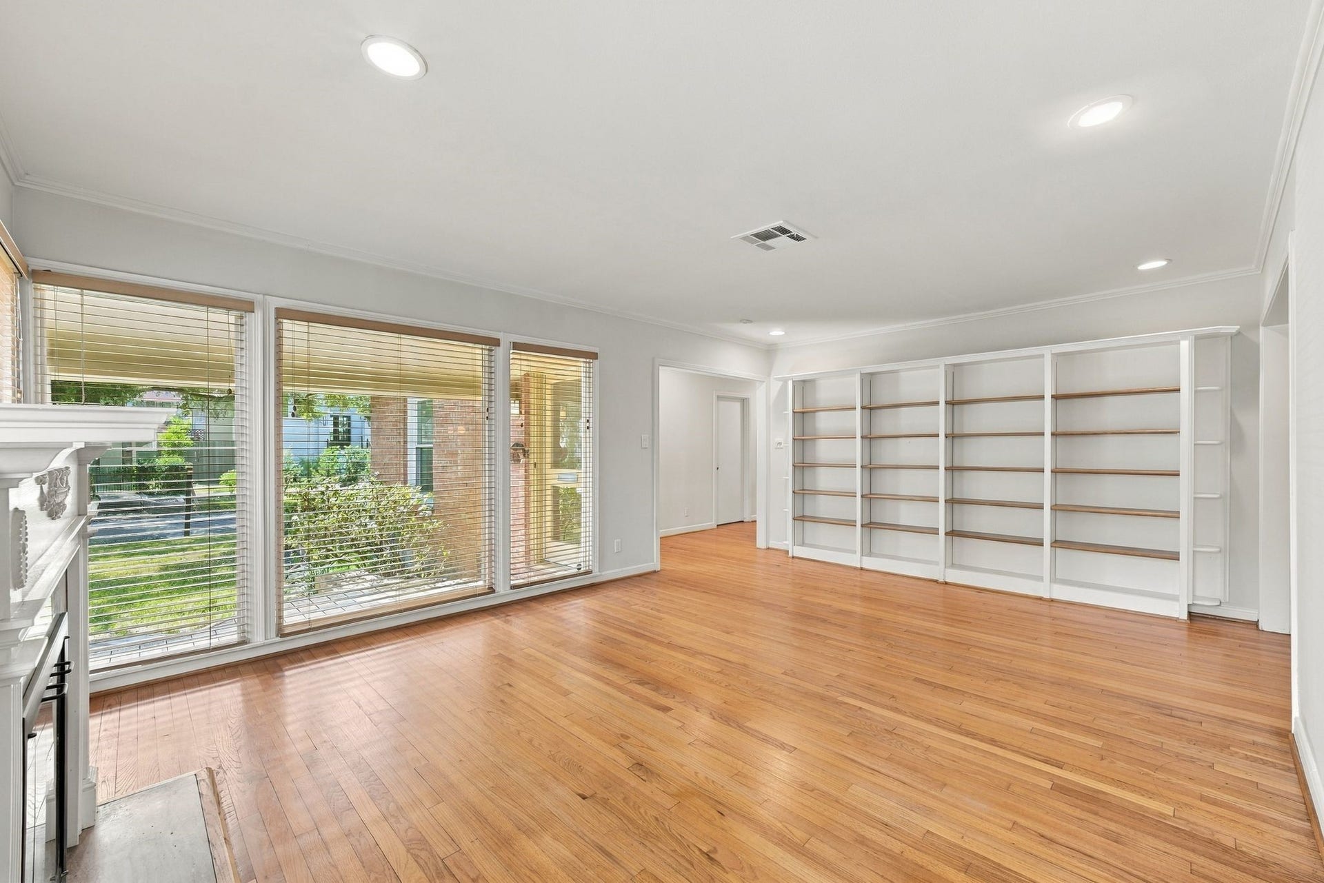 2206 Macarthur Street, Houston, TX 77030 Opposite end of living room has built in bookshelves perfect for books, photos and collections