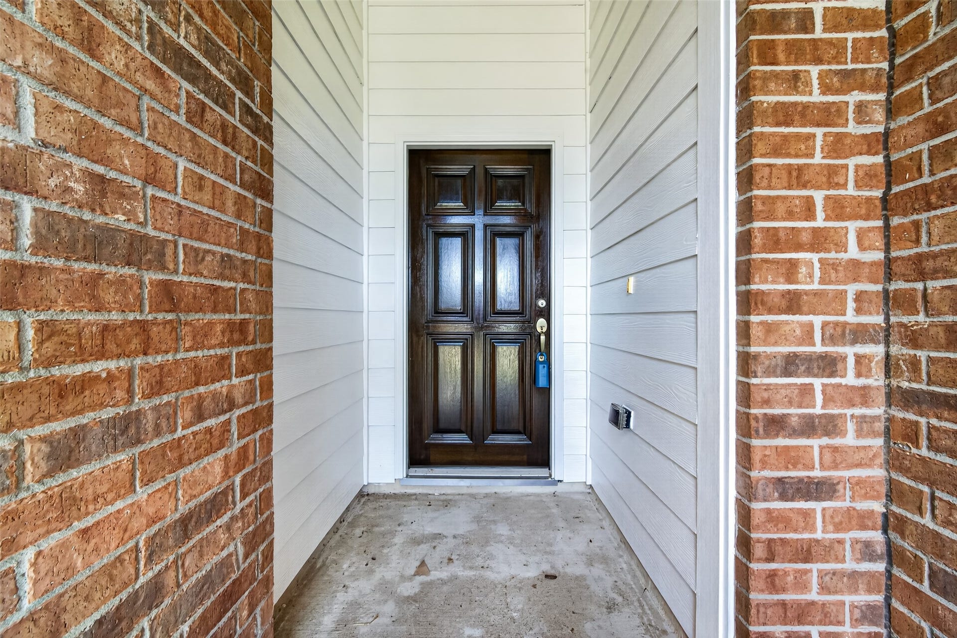 Covered entryway protects your guests and packages from the weather AND the front door has been REPAINTED!