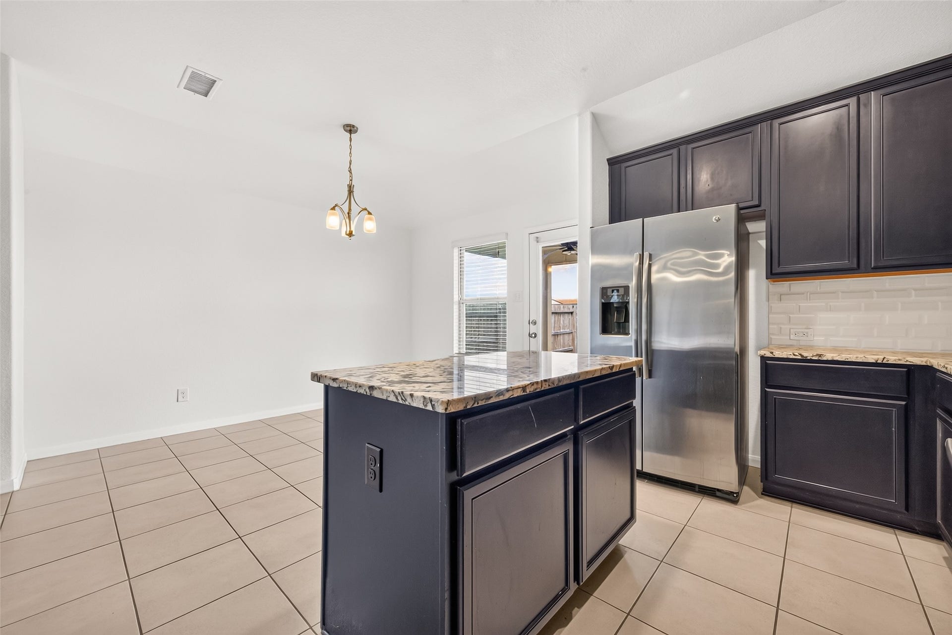 Love the kitchen island for meal prep, serving space, or making cookies! Extra storage space underneath.