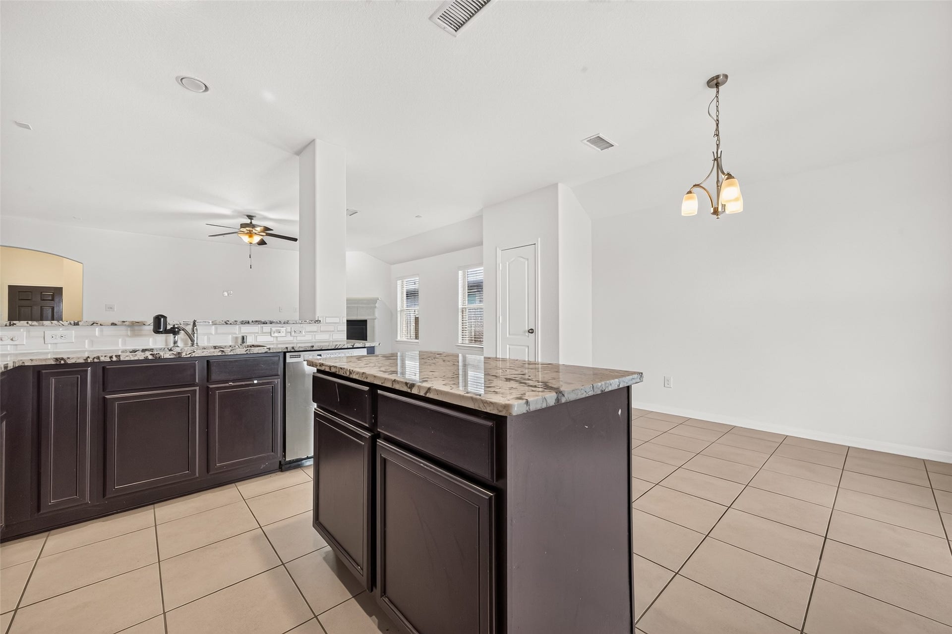 This home also has a separate pantry located between the dining and living areas.