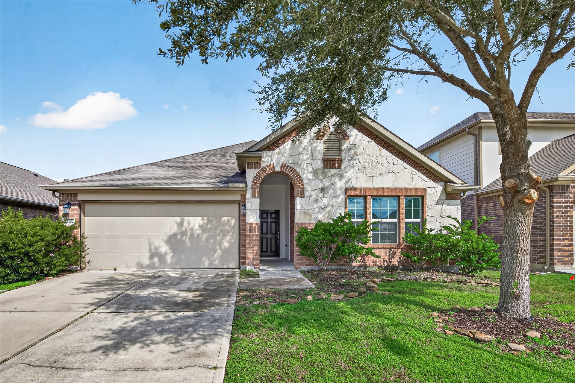Welcome to Creekside Ranch. 26602 Yukon Straight Drive is back on the market with FRESH PAINT and NEW FLOORING!