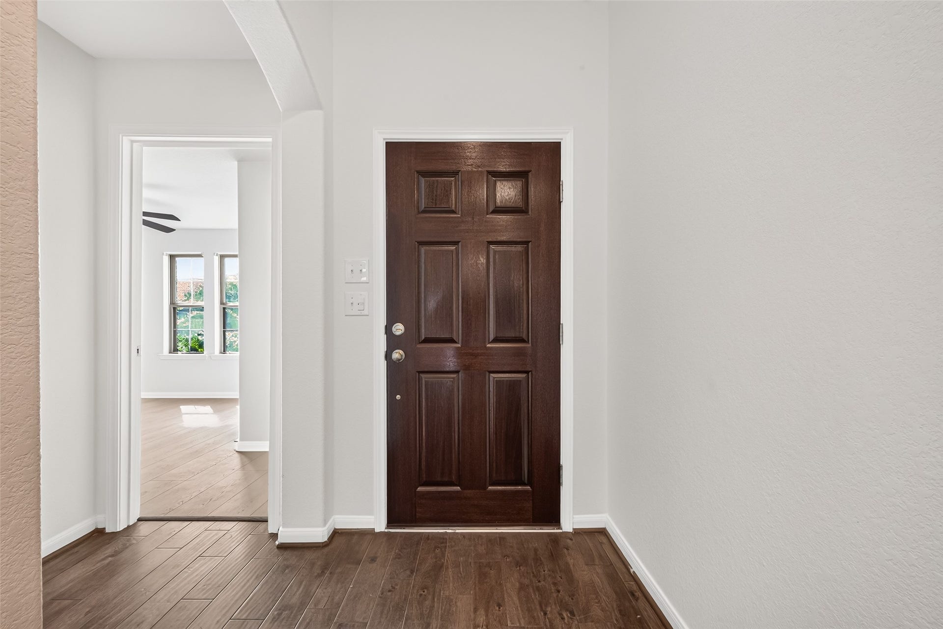 When you enter the home, the 2 secondary bedrooms and full secondary bathroom are located in the hallway to the right, and the utility room and garage entry are located in the hallway to the left.