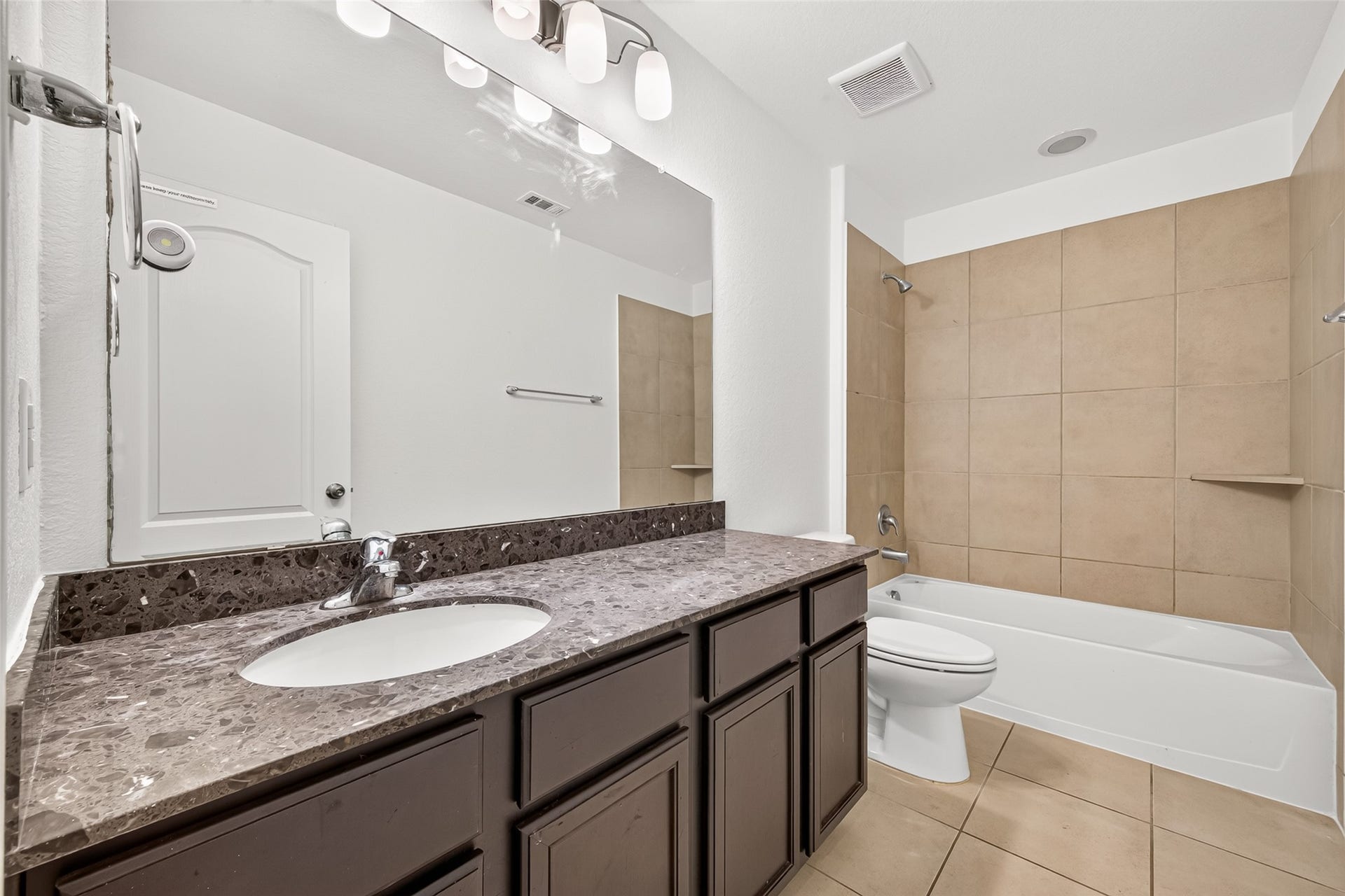 Full secondary bathroom shared by secondary bedrooms 1 and 2 with tub/shower combo