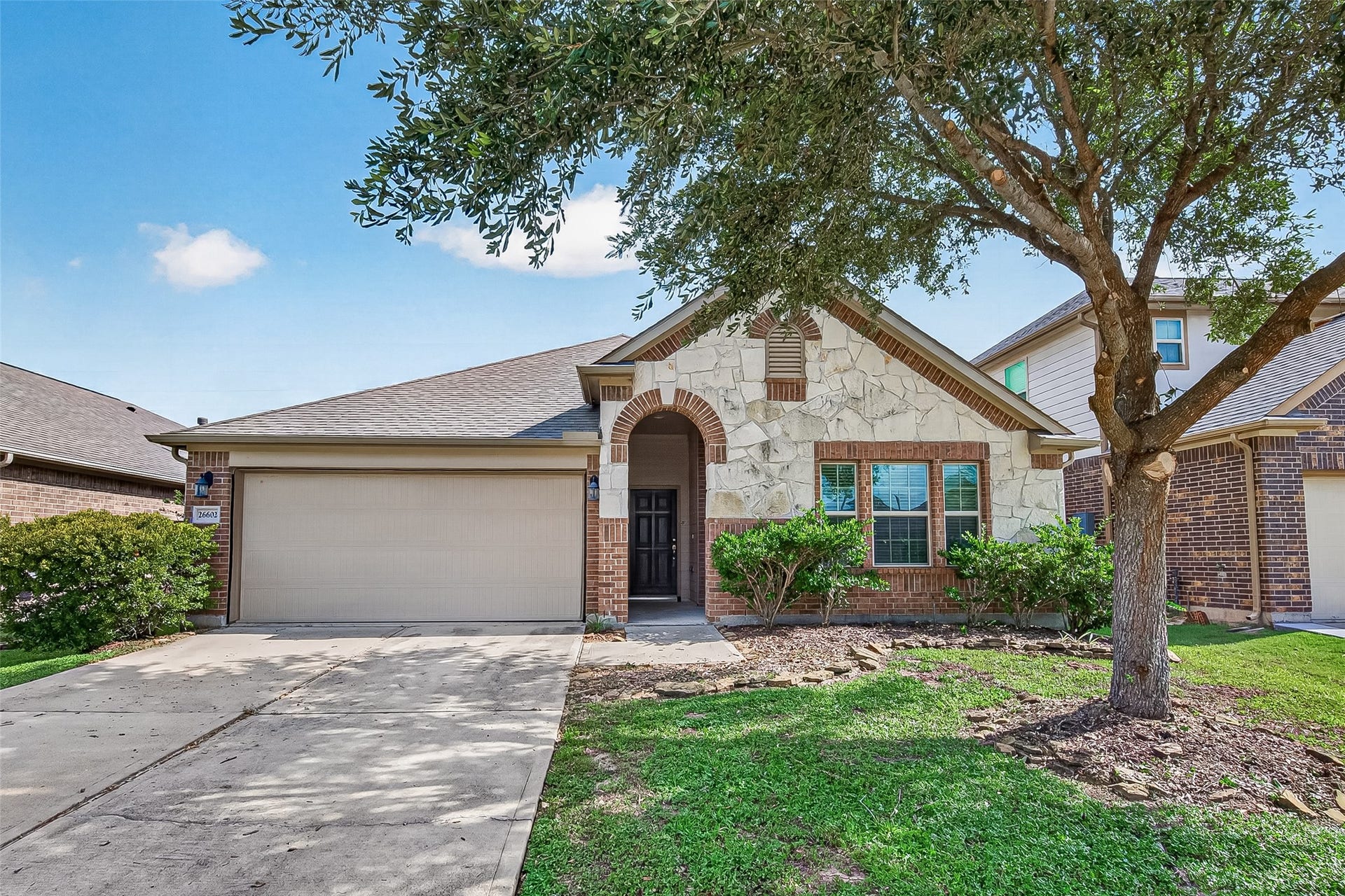 2 car garage and double wide driveway provide plenty of parking space