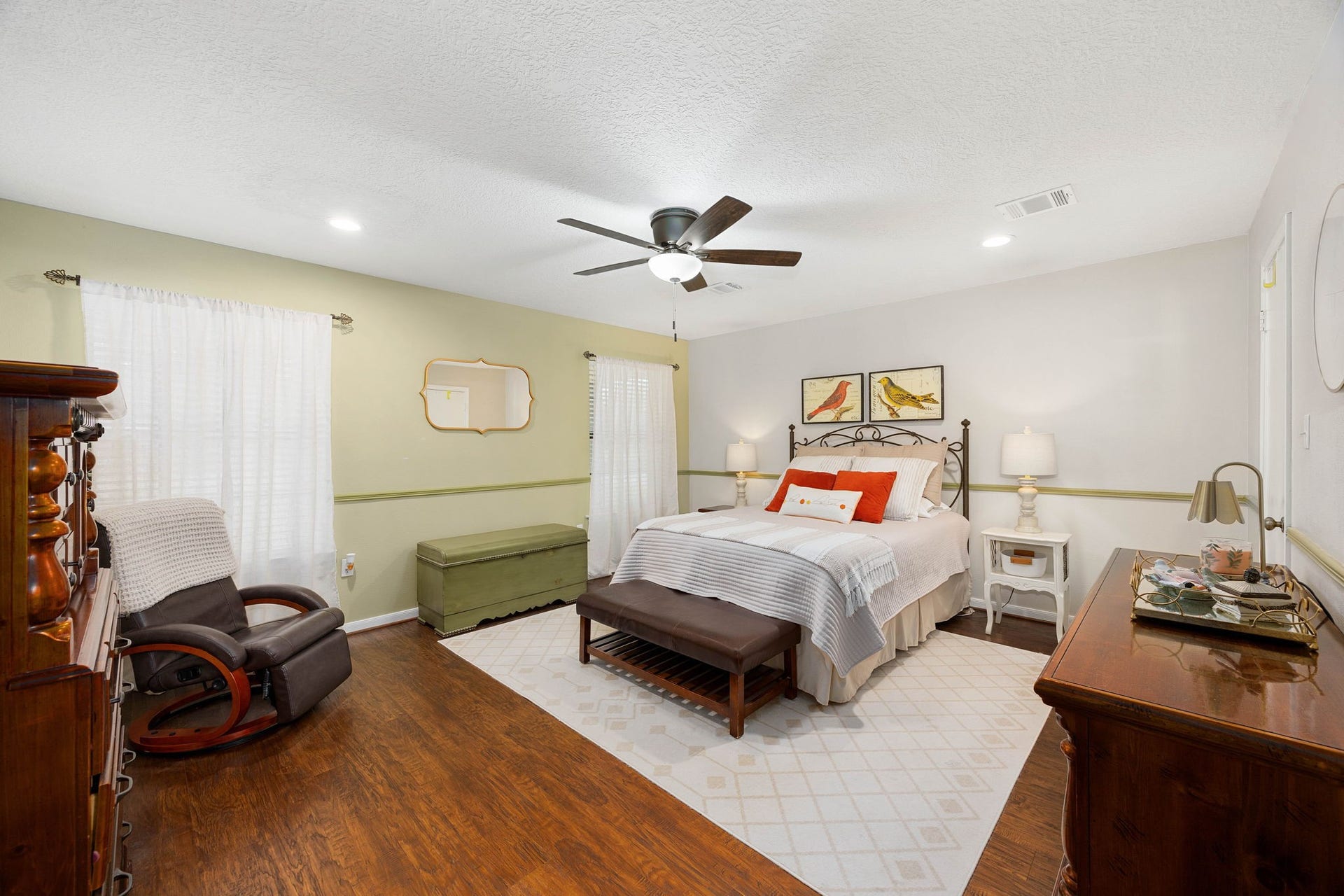 Spacious first-floor primary bedroom offers a comfortable private retreat.