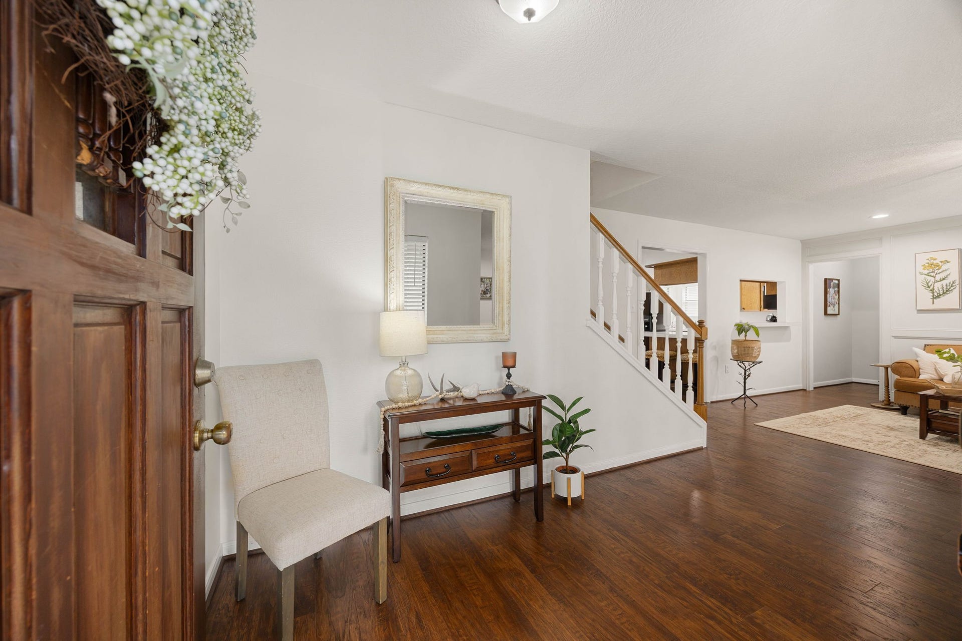 Open entry provides easy access to the formal dining area and main living spaces.