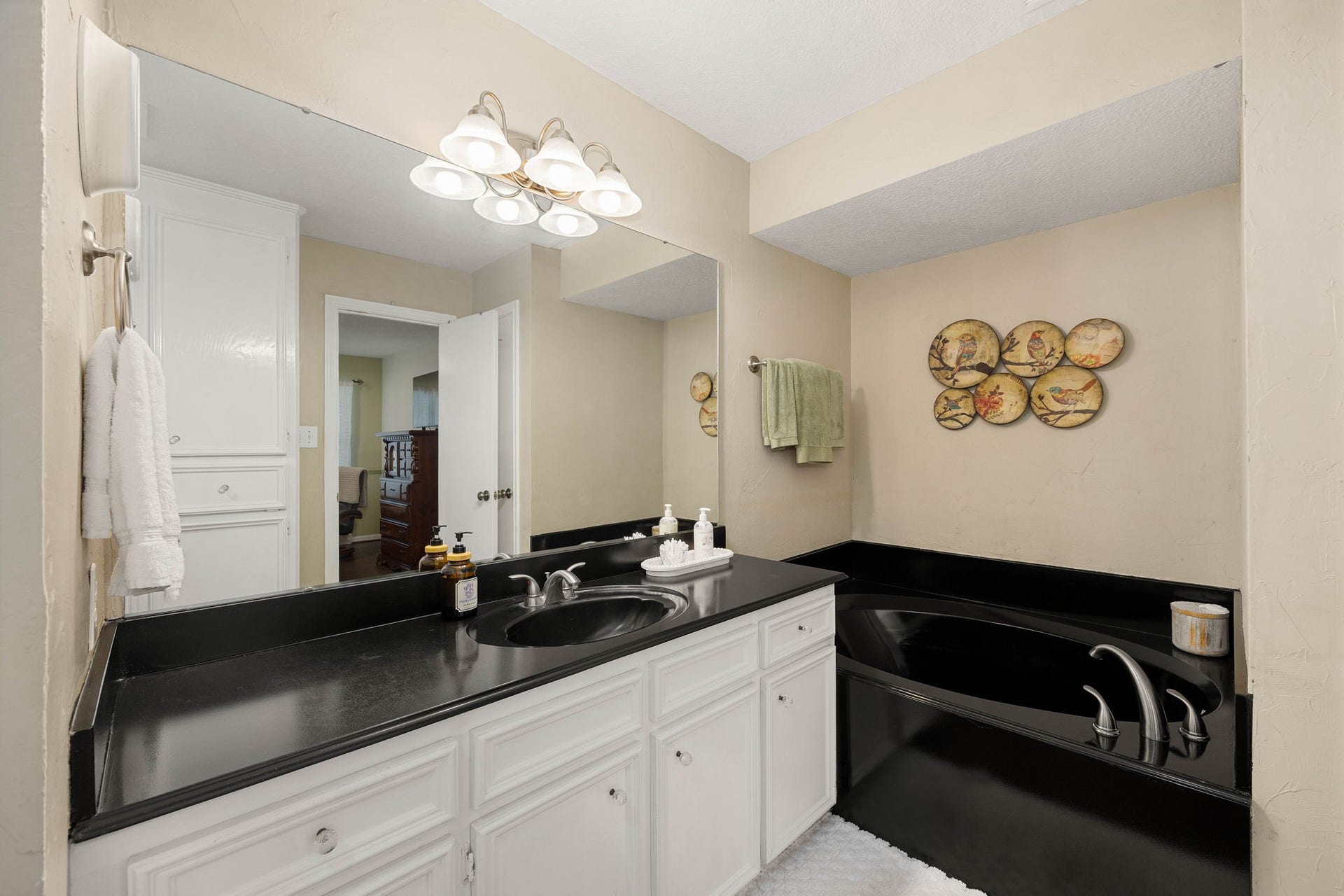 Separate vanity areas provide additional counter space and functionality.