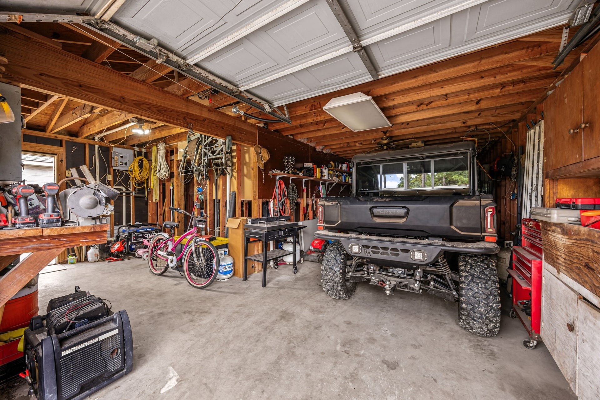 Detached garage and workshop offer valuable space for parking, storage, hobbies, or projects.