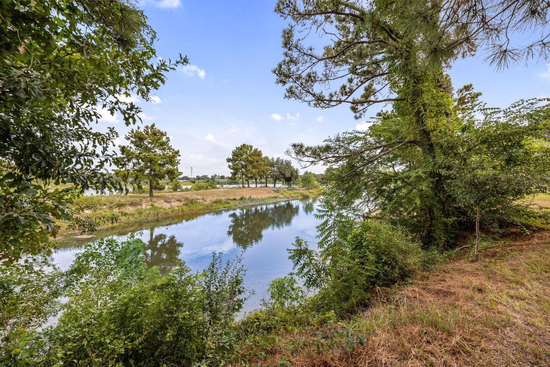 Peaceful nearby lake views add to the scenic surroundings; property does not have direct lake access.