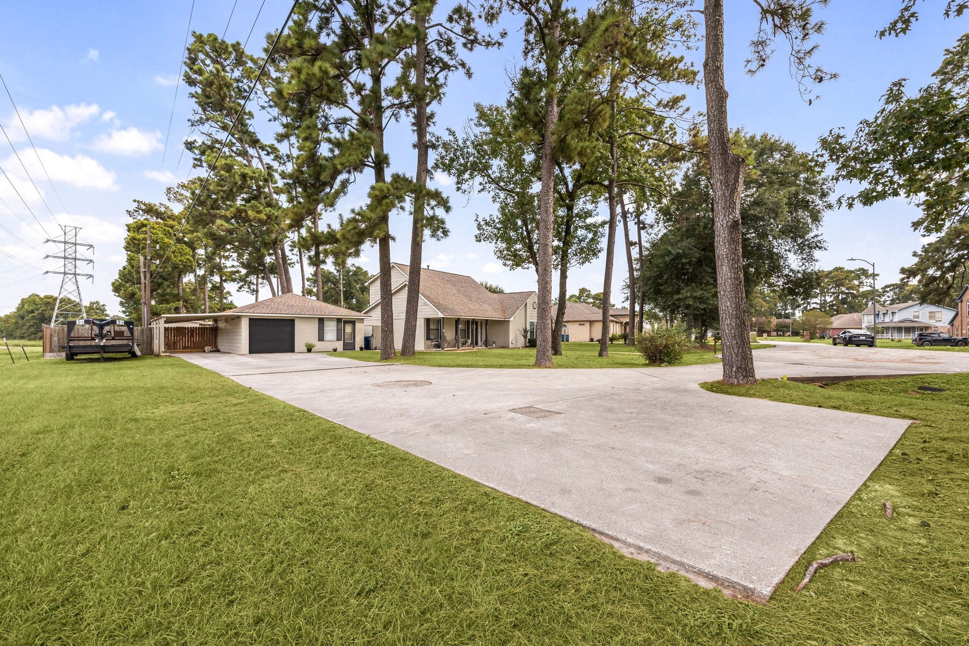 Extended driveway provides plenty of space for parking and easy access to the property.