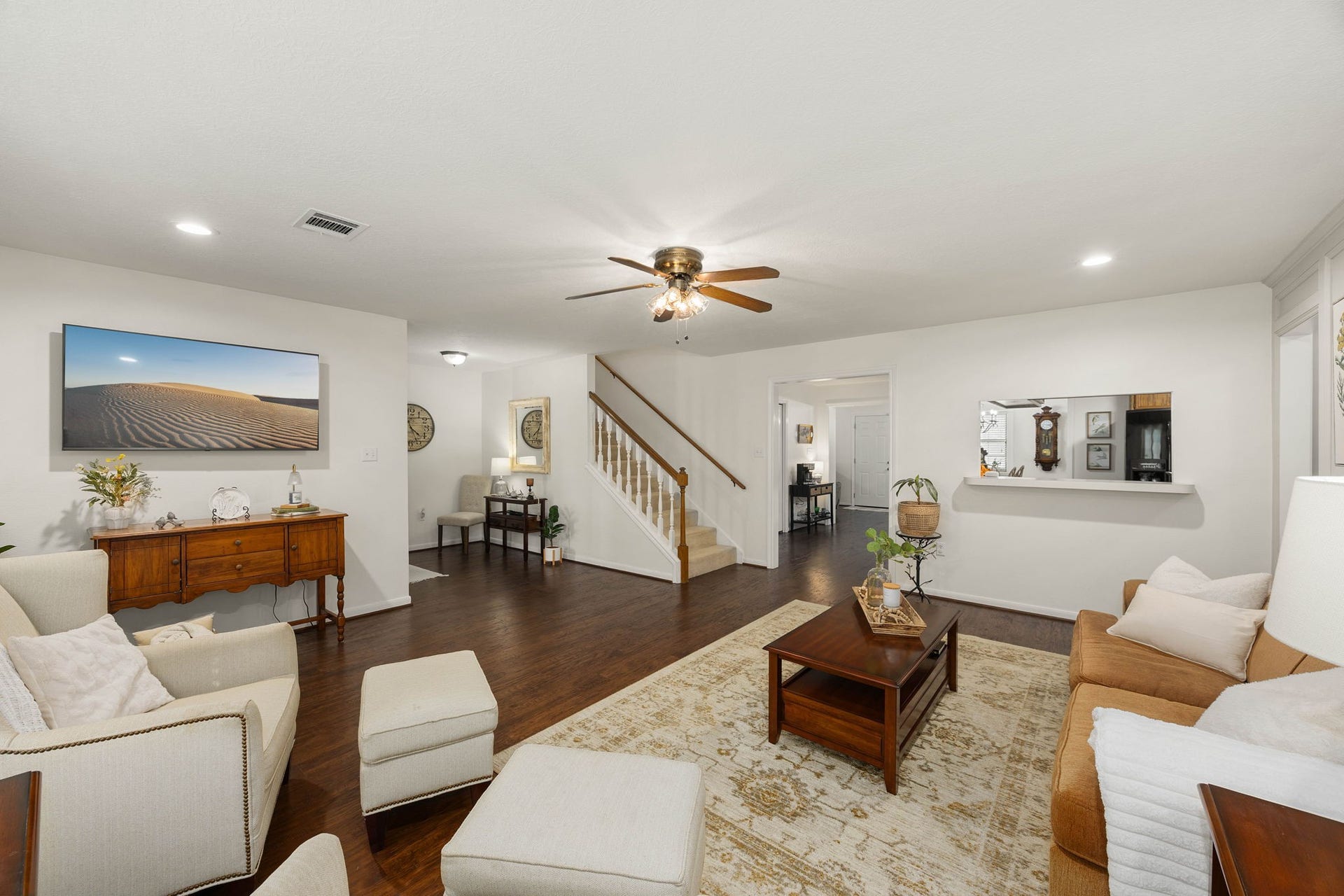 Spacious main living area with large windows overlooking the property.