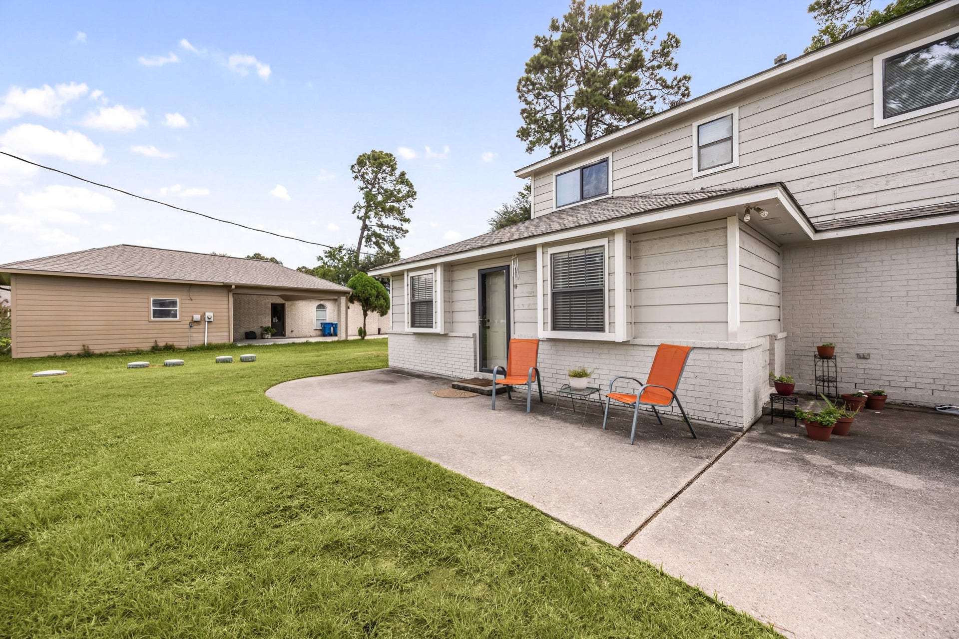 Spacious grassy yard offers plenty of room to enjoy the outdoors.