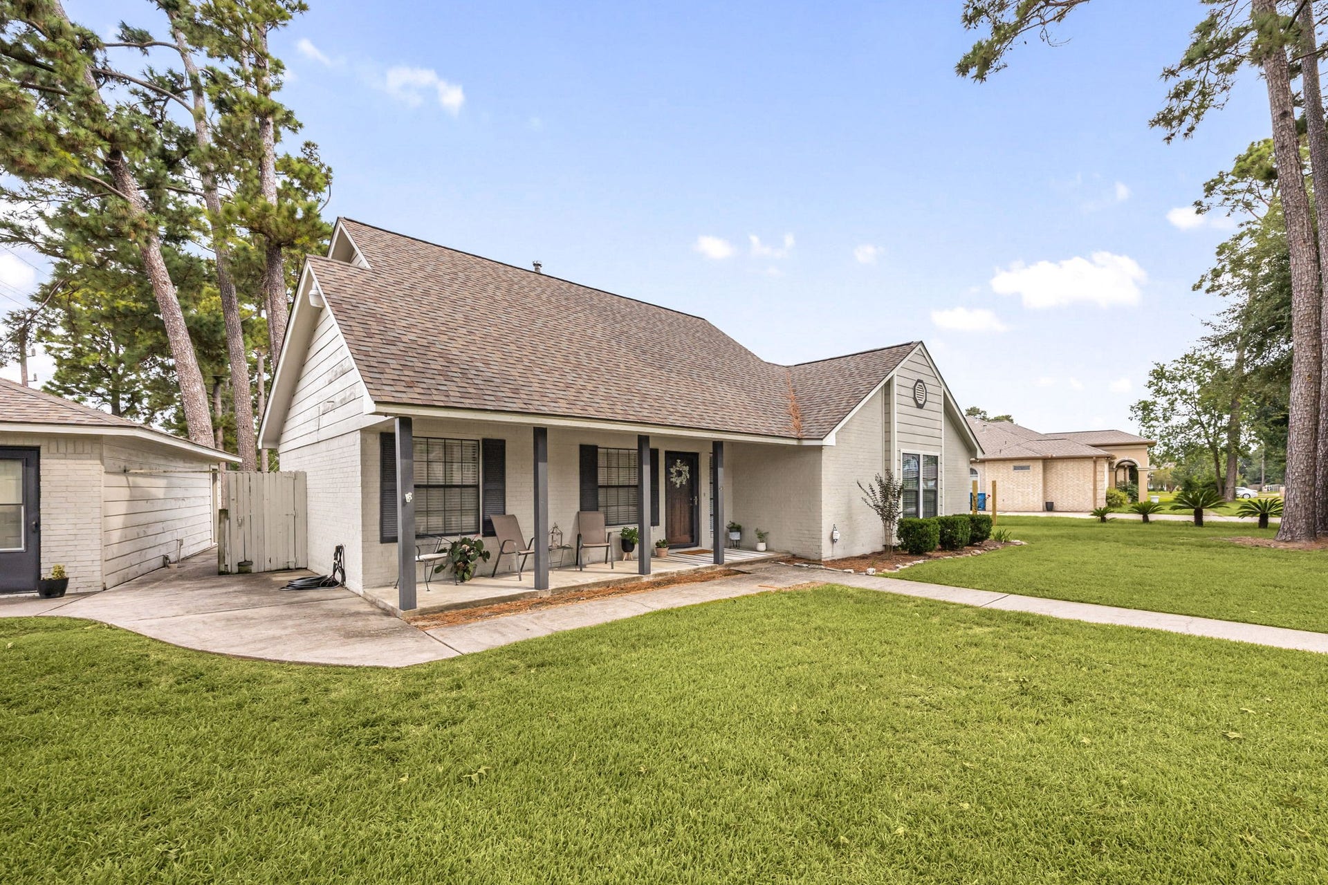 Welcoming front porch offers a charming spot to relax and enjoy the peaceful surroundings.