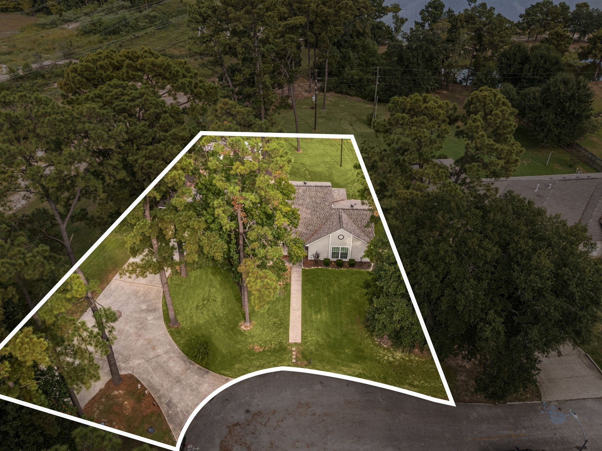 Aerial perspective highlighting the homes generous lot and cul-de-sac setting.