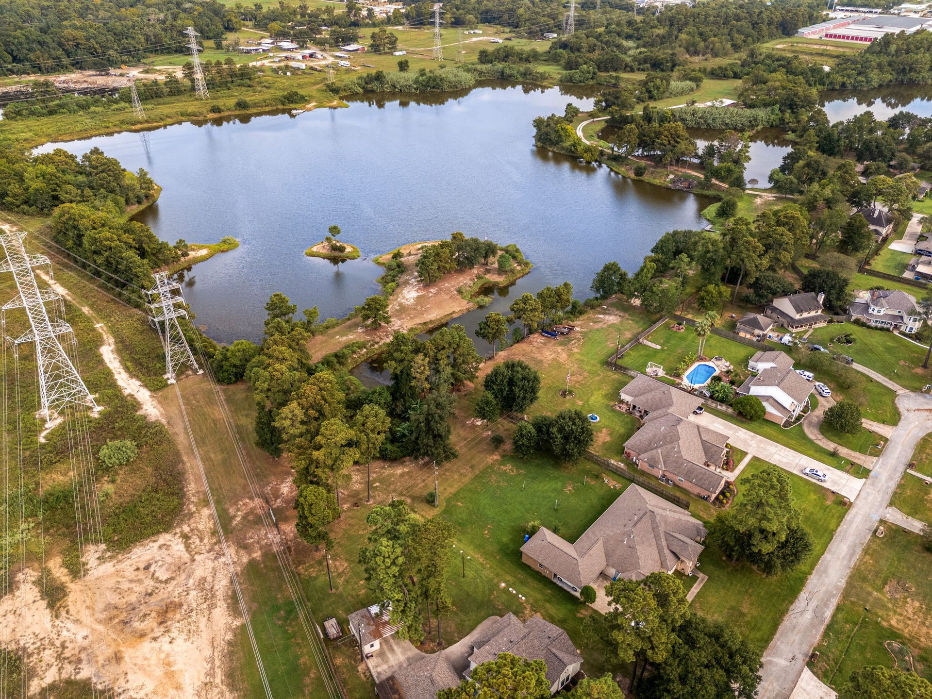 Neighborhood aerial highlights the spacious homesite and surrounding residential setting.