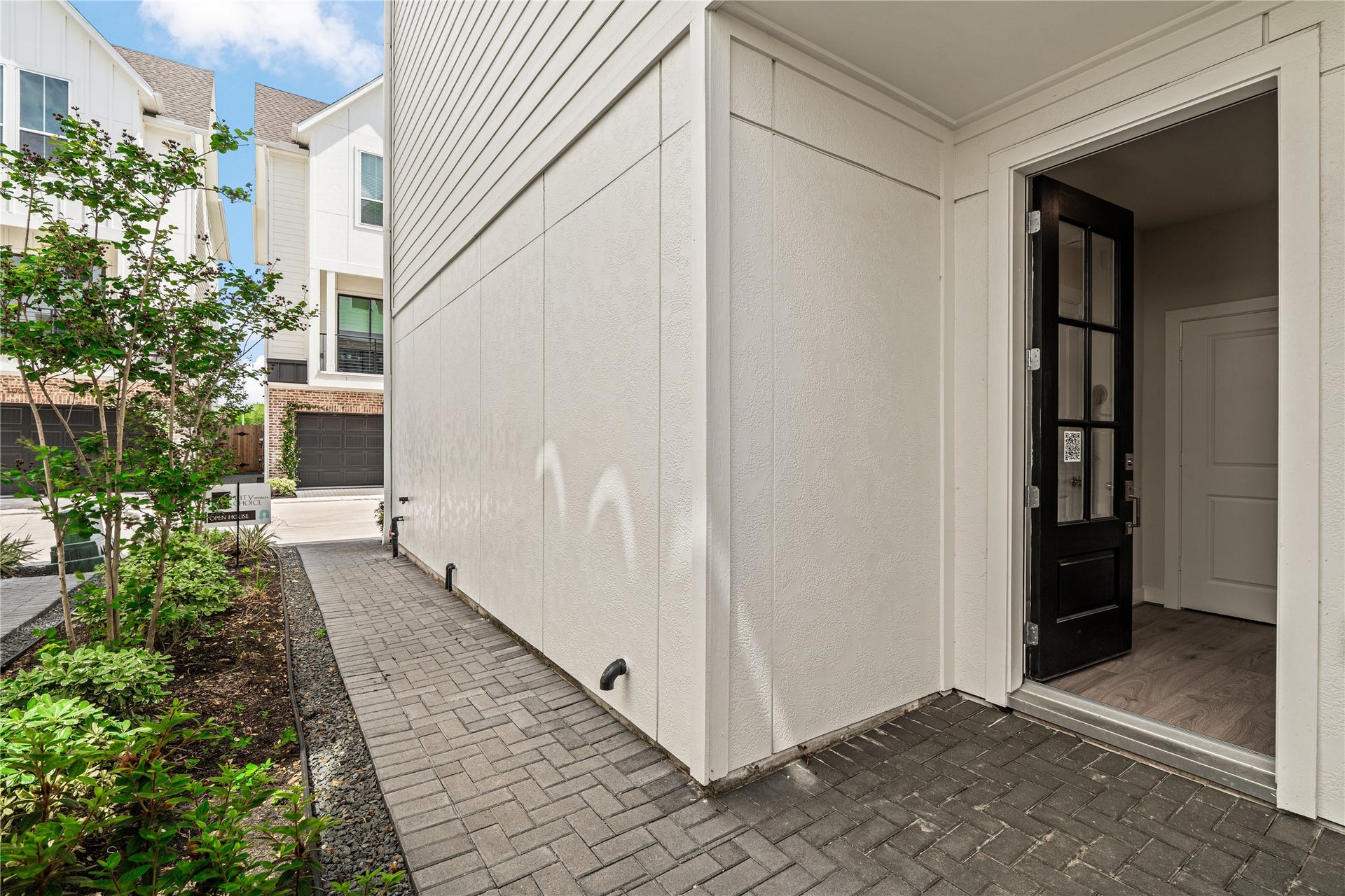 Representative exterior photo of the same plan in the community. Layout may vary.