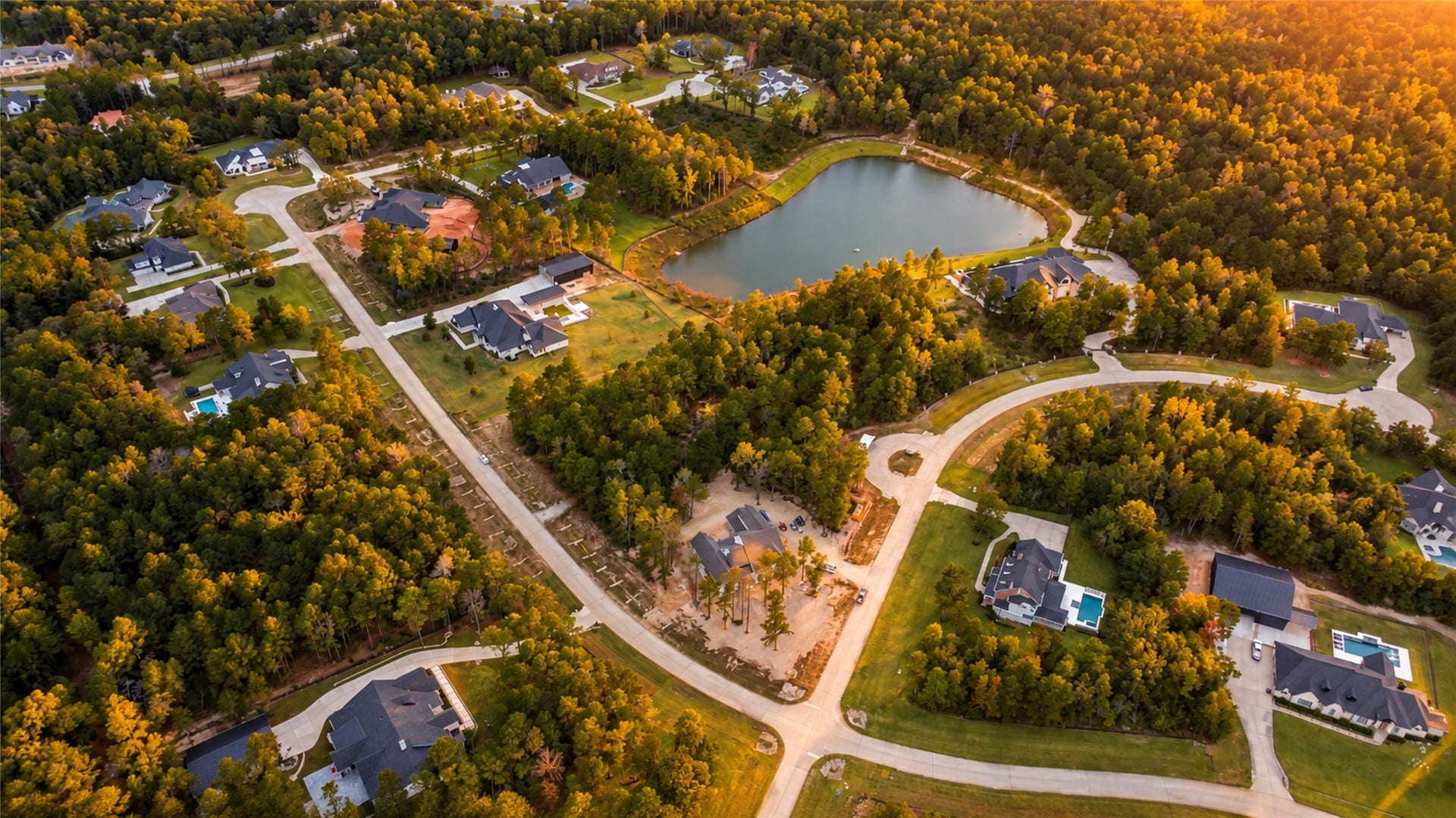 7078 Texas Trace, Montgomery, TX 77316 An aerial view captures the surrounding tree canopy and established homes of High Meadow Estates.