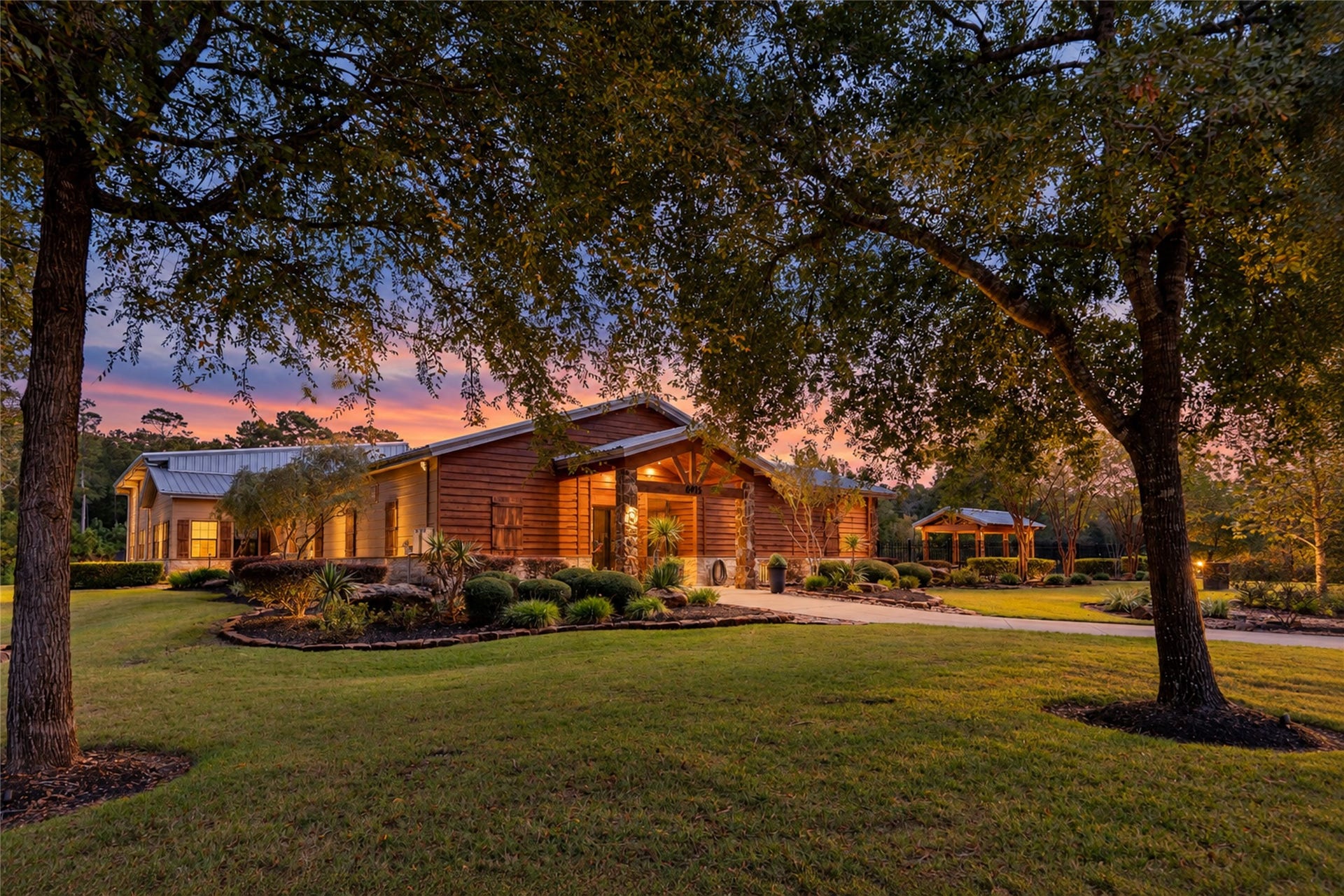 7078 Texas Trace, Montgomery, TX 77316 A welcoming covered entrance and landscaped walkway at the community amenity center.