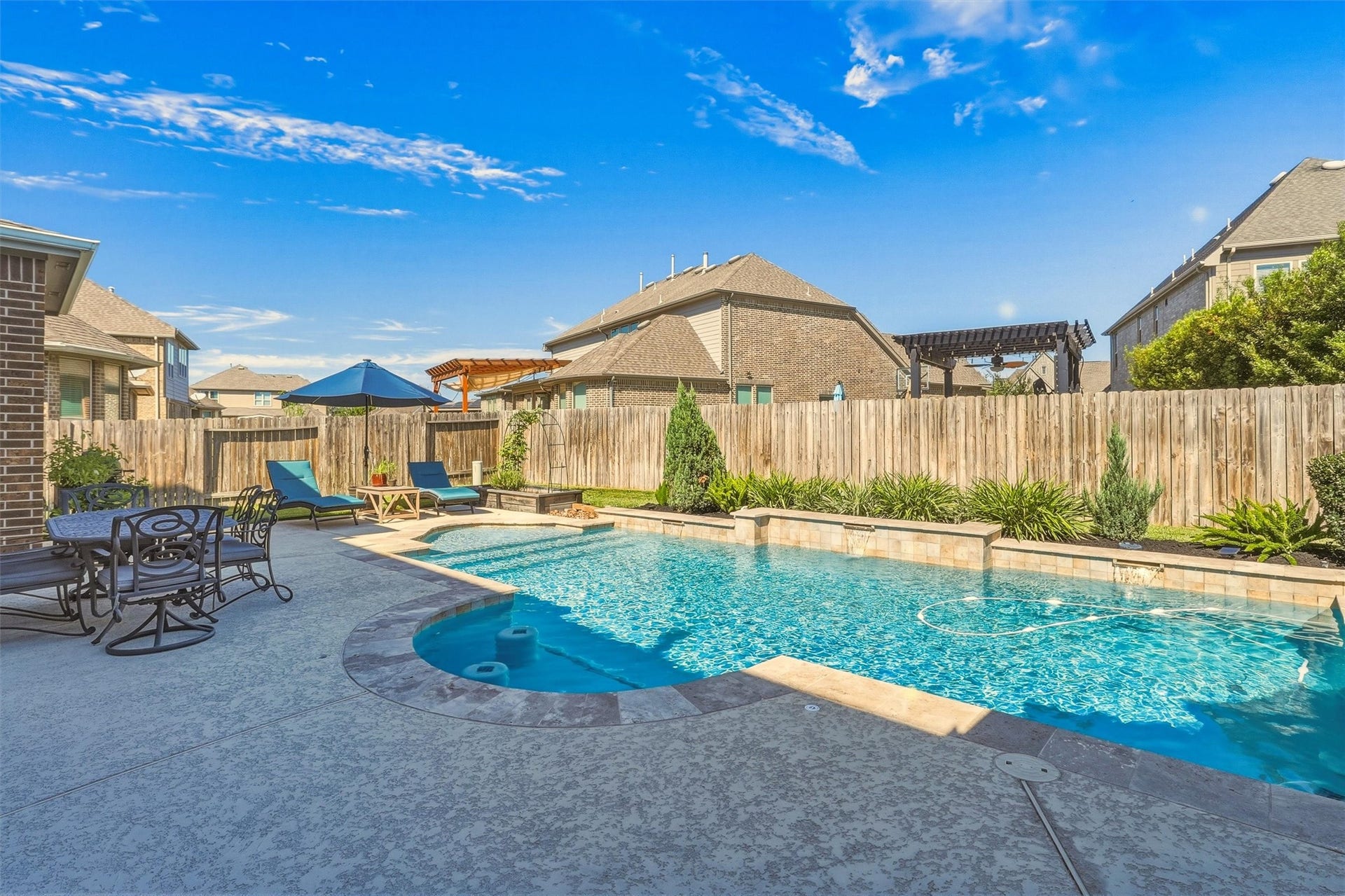 1407 Trails Of Katy Lane, Katy, TX 77494 A heated private pool brings a new rhythm to the weekend. The curved pool design and surrounding decking create a welcoming setting for a refreshing swim, a casual get-together or a quiet afternoon close to home.