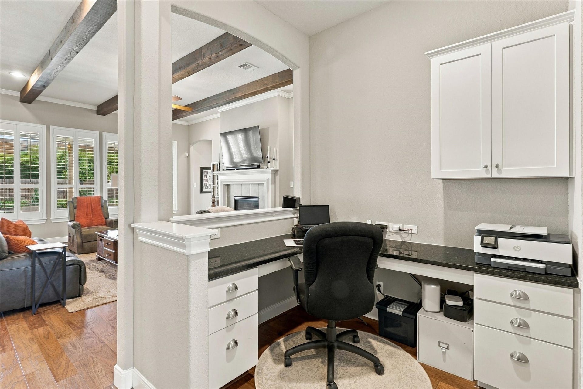1407 Trails Of Katy Lane, Katy, TX 77494 A place for the details that keep life moving. The built-in planning center offers a dedicated work surface, drawers and overhead cabinetry for calendars, paperwork or a laptop, conveniently positioned near the homes main gathering spaces.