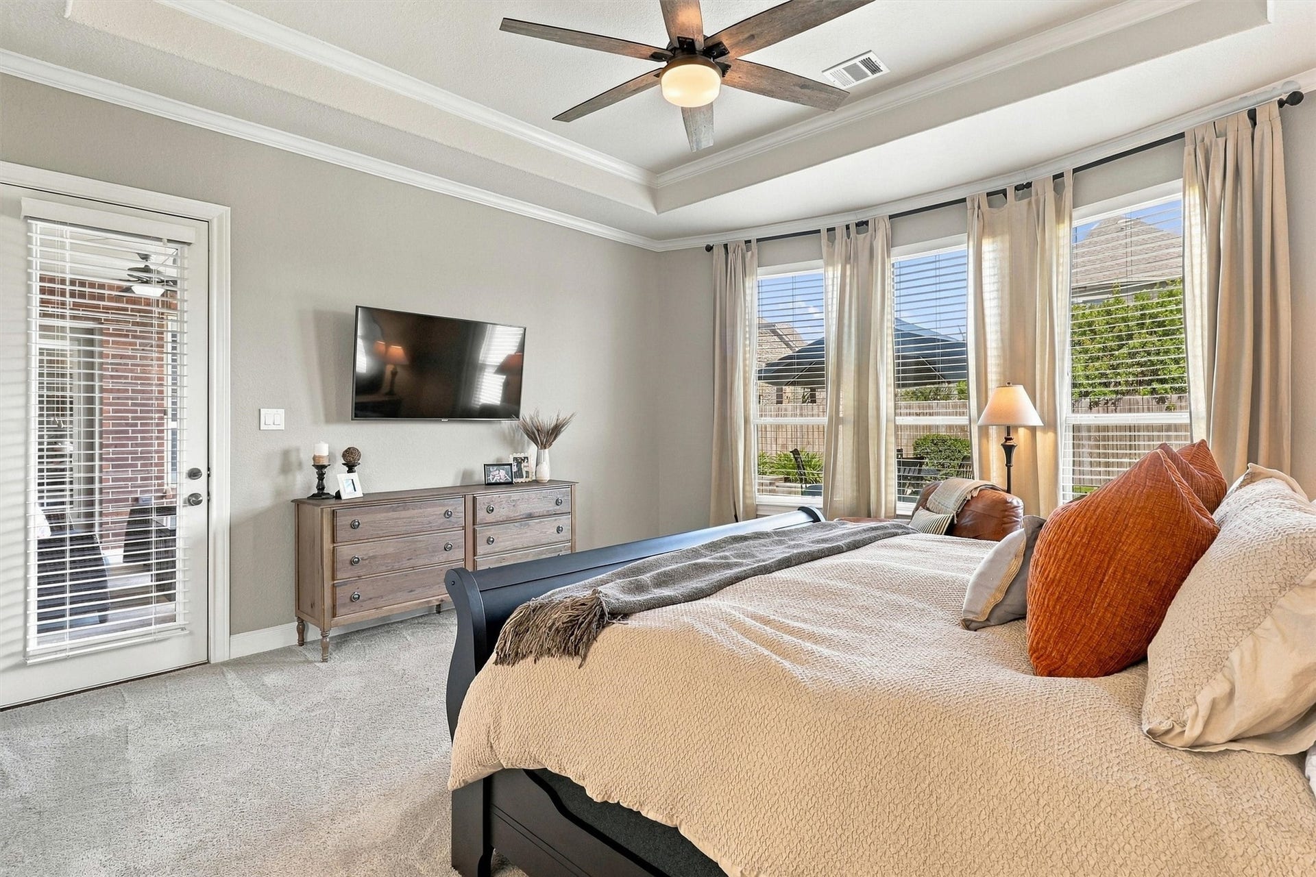 1407 Trails Of Katy Lane, Katy, TX 77494 This wider view reveals the scale of the primary suite and its connection to the separate sitting area. Backyard-facing windows bring in daylight, while the generous layout lets you create distinct places to rest and unwind.