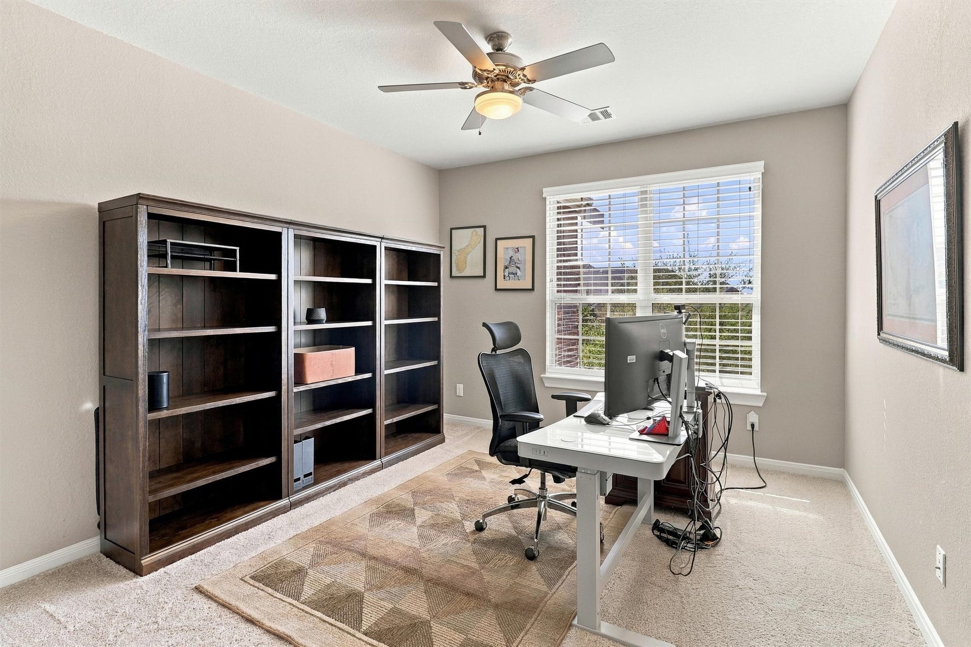 1407 Trails Of Katy Lane, Katy, TX 77494 A bright upstairs bedroom offers room for more than one purpose. Currently used as an office, its window, ceiling fan and generous wall space make it easy to envision a bedroom with a desk, reading corner or creative workspace.
