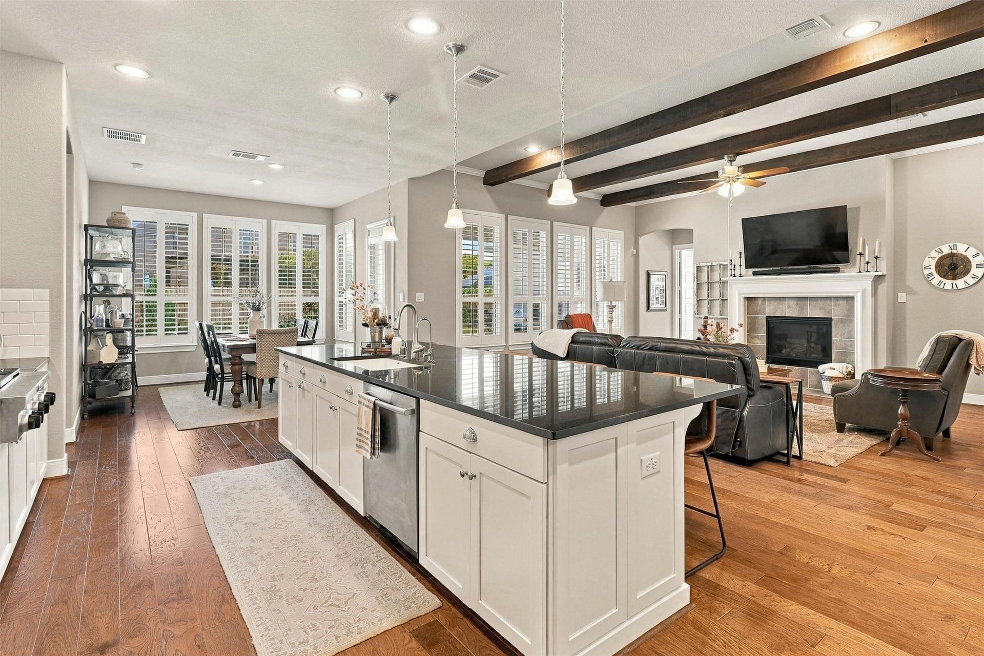 1407 Trails Of Katy Lane, Katy, TX 77494 From the kitchen island to the fireplace, the main living spaces feel connected. Prepare dinner while chatting with guests, keep refreshments within reach and enjoy a layout that supports both entertaining and everyday life.