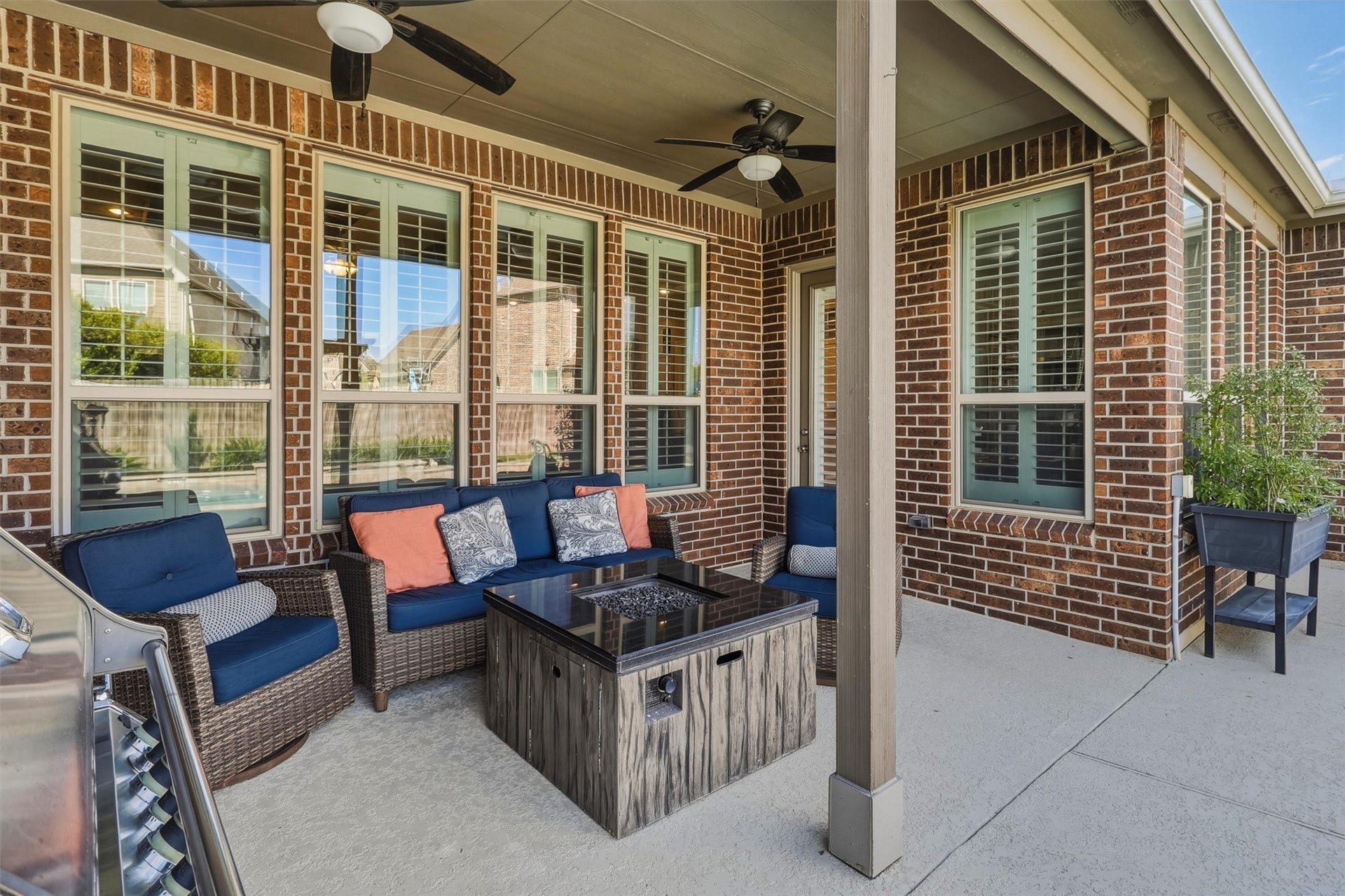 1407 Trails Of Katy Lane, Katy, TX 77494 Your living space continues outdoors. The covered patio offers a sheltered place for conversation and refreshments, with ceiling fans overhead and backyard-facing windows connecting the setting to the homes inviting interior.