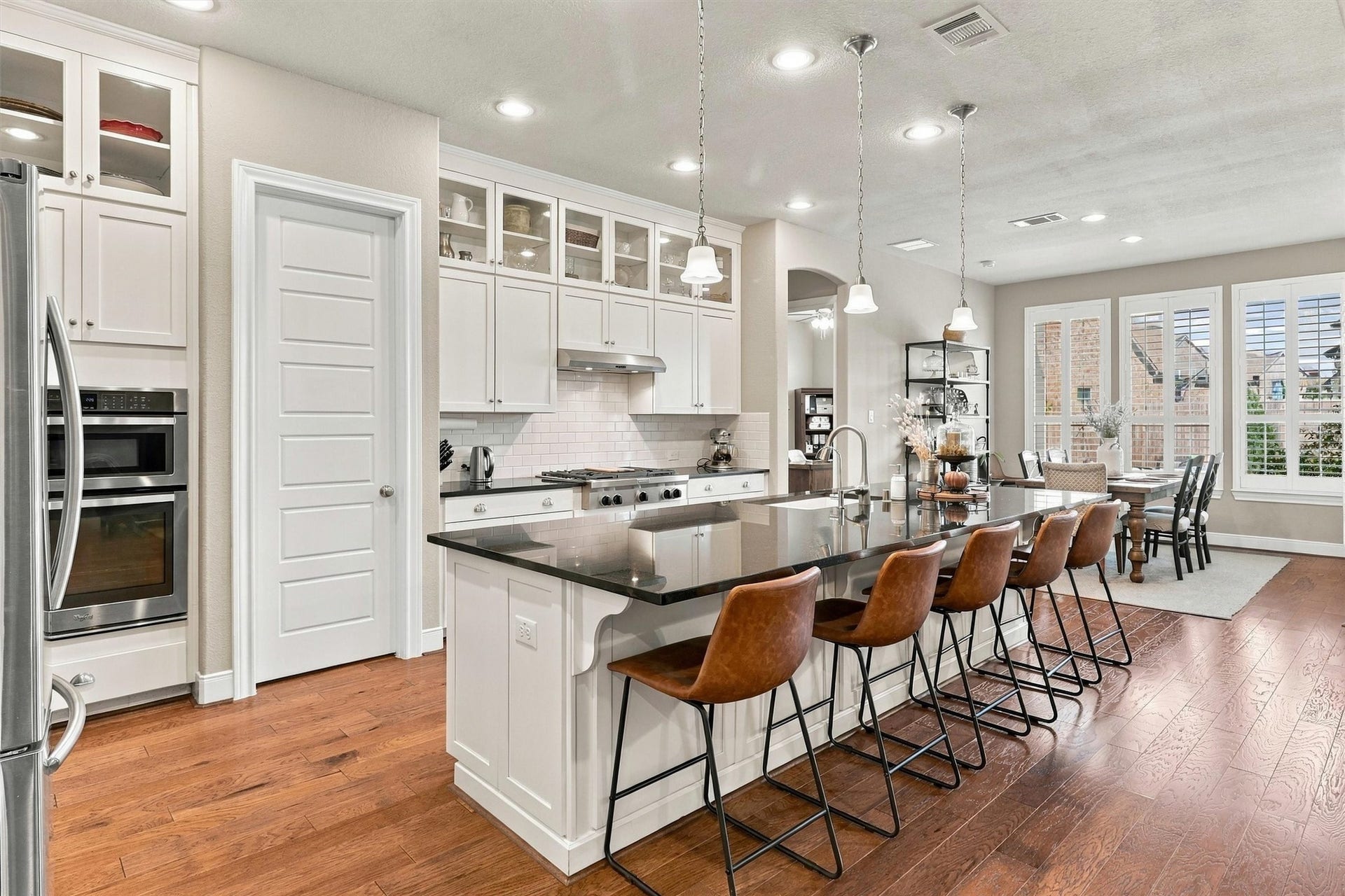 1407 Trails Of Katy Lane, Katy, TX 77494 Pull up a seat and stay awhile. The substantial kitchen island combines a generous preparation surface with casual seating, making it a natural gathering spot for morning coffee, after-school conversations and appetizers before dinner.