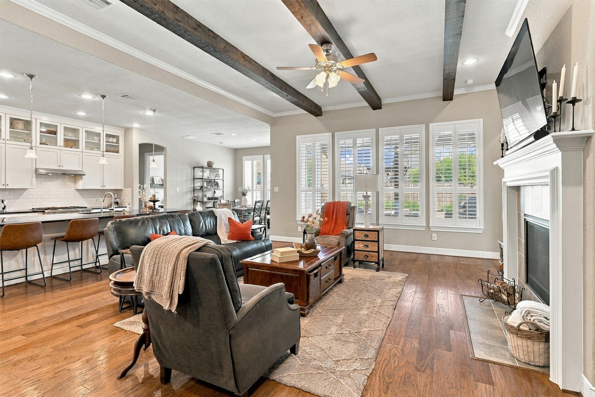 1407 Trails Of Katy Lane, Katy, TX 77494 With a listed footprint of approximately 17 by 21 feet, the living room offers room to gather comfortably. Backyard-facing windows and plantation shutters frame the space, creating an inviting setting for relaxed afternoons and lively evenings.