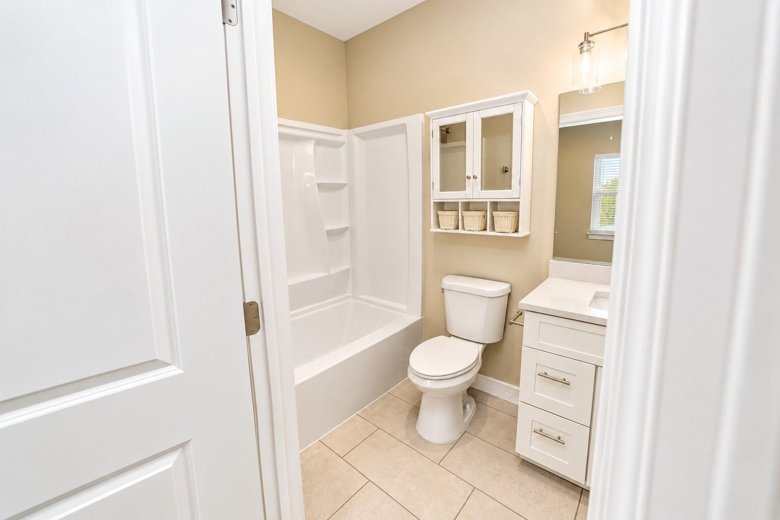 3248 Creekmont Drive, Houston, TX 77091 Bright and modern bathroom featuring a sleek vanity with ample storage, a convenient shower-tub combo, and elegant fixtures for a refreshing retreat.