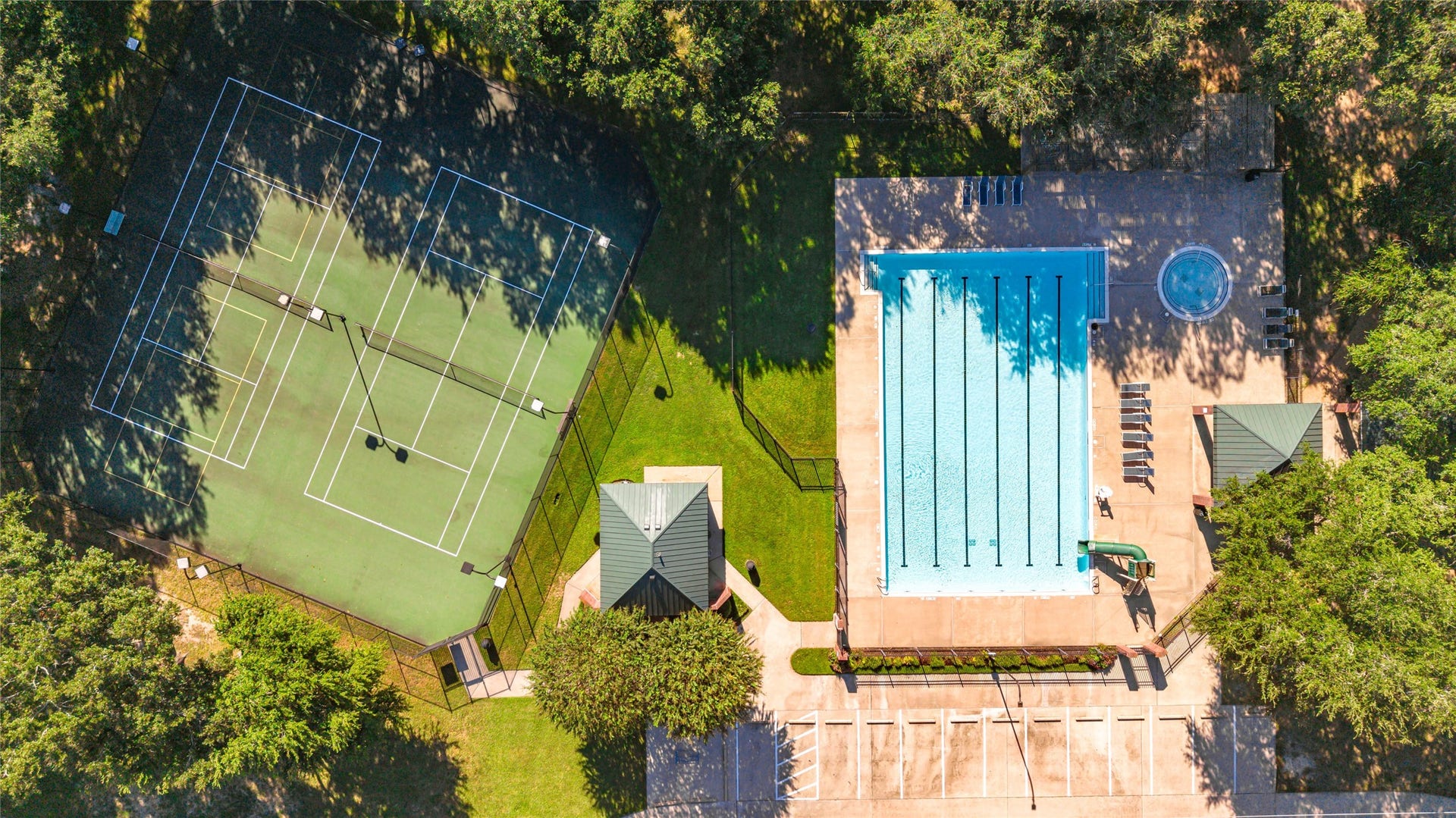 1344 Coleman Boylan Drive, League City, TX 77573 Experience resort-style living with access to a pristine pool, and well-maintained tennis courts, all surrounded by lush greenery for privacy and relaxation.