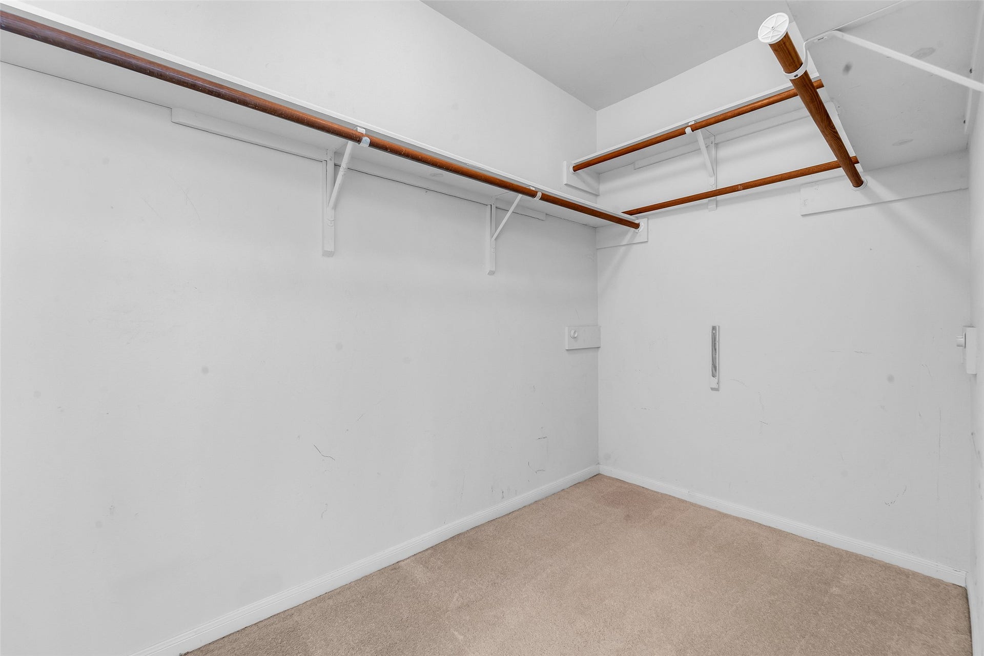 1344 Coleman Boylan Drive, League City, TX 77573 Spacious walk-in closet with dual-level shelving and ample hanging space, perfect for organizing your wardrobe. 1 of 2 closets in the primary.