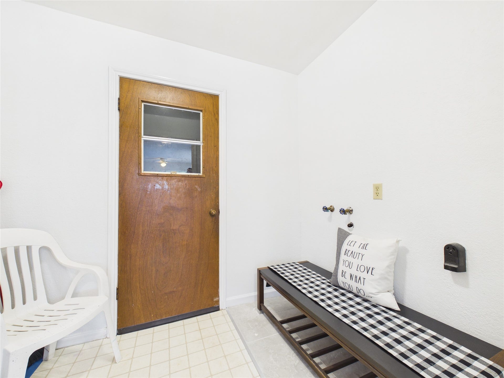1909 Tracy Lynn Lane, Alvin, TX 77511 In house laundry room located just off the kitchen. This door leads to the two car garage that has a nice work bench/storage area and an added side door that gives access in/out without having to open the garage doors.