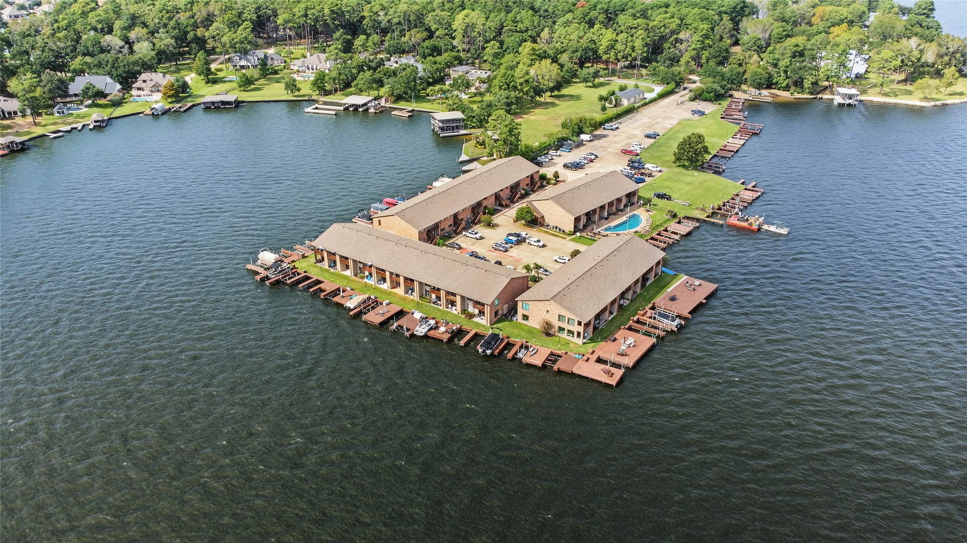 Waterfront living at its finest, with community boat slips, swimming pool, and panoramic lake views.
