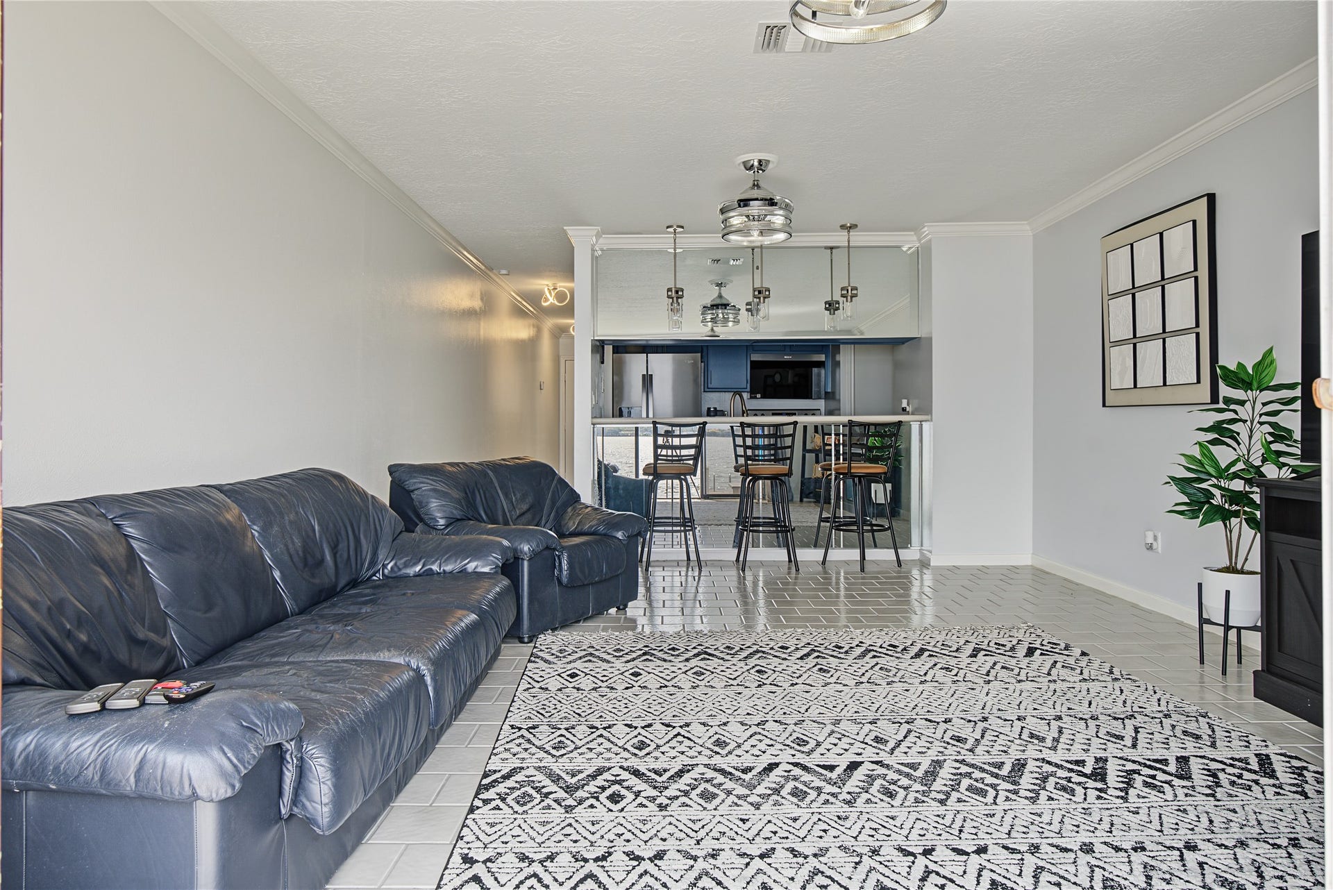 Open living and dining arrangement provides a comfortable flow between the kitchen and gathering space.
