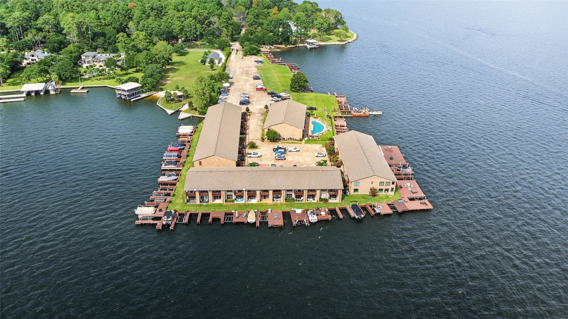 Beautiful aerial perspective highlighting the property's exceptional position along the open waters of Lake Conroe.