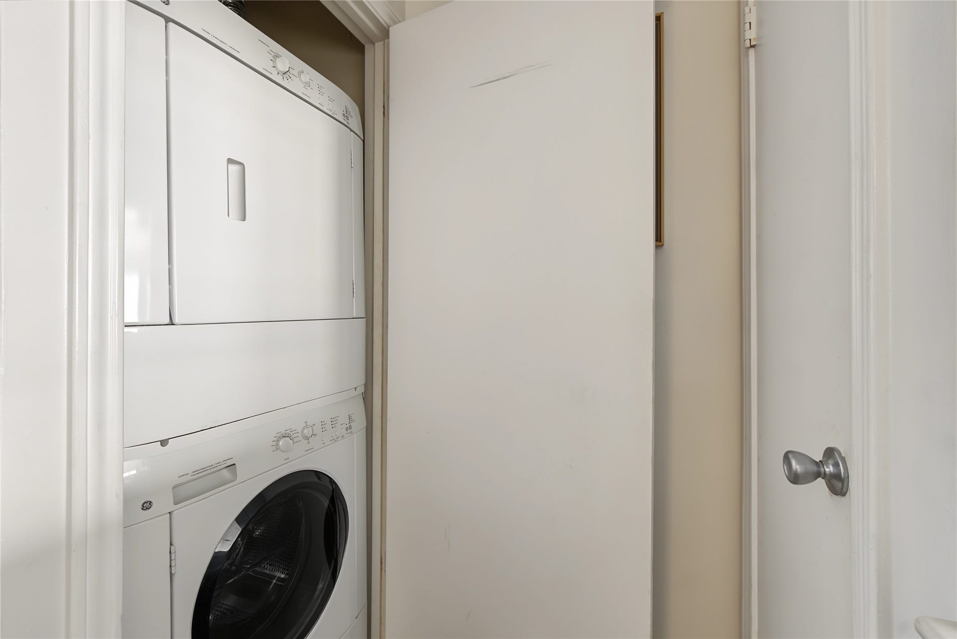 Convenient in-unit stacked washer and dryer included with the condominium.