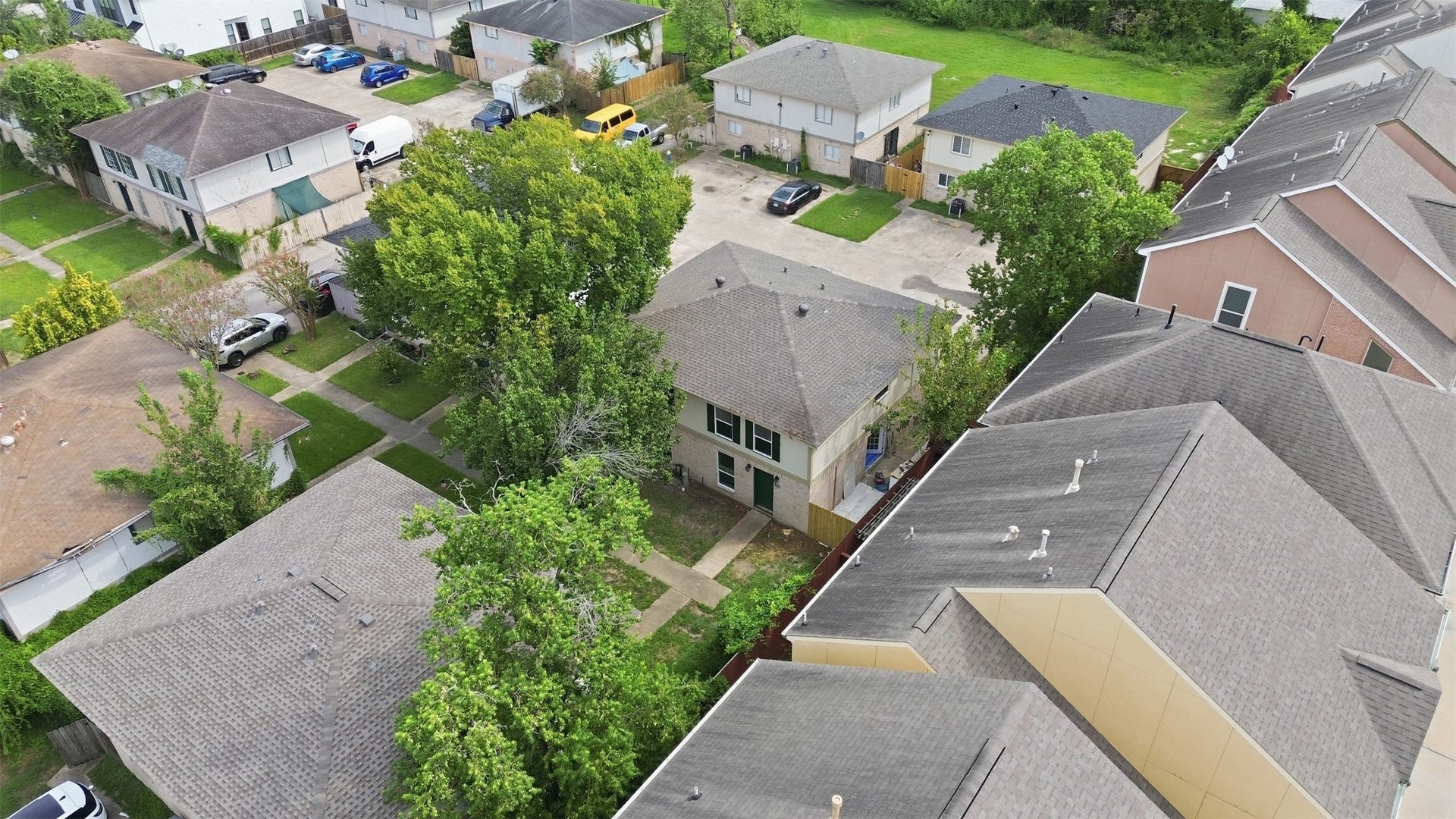 1936 Upland Drive, Houston, TX 77043 Charming two-story home nestled in a quiet neighborhood, surrounded by lush greenery and conveniently close to neighboring residences.