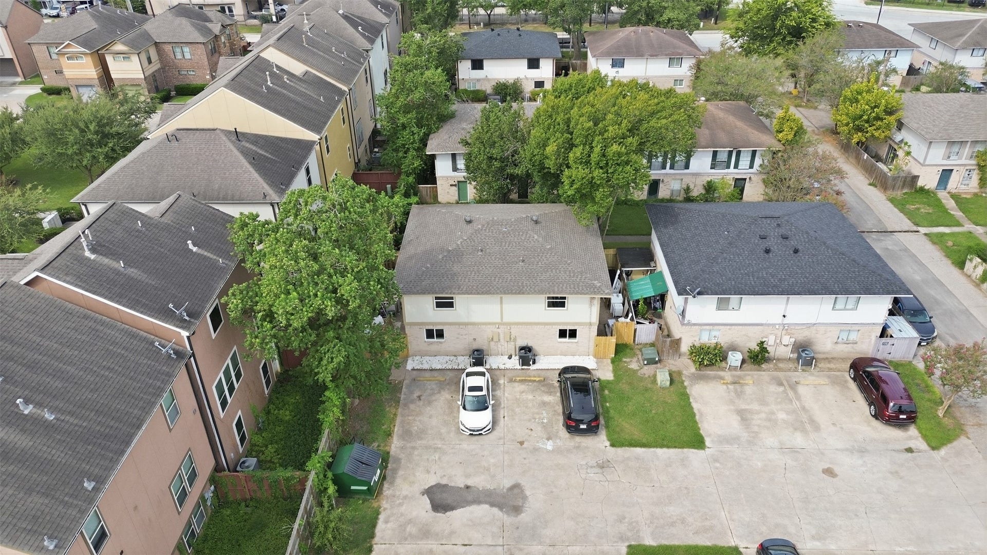 1936 Upland Drive, Houston, TX 77043 Charming two-story home nestled in a quiet neighborhood, featuring ample parking space and surrounded by lush greenery, offering a serene and private setting.