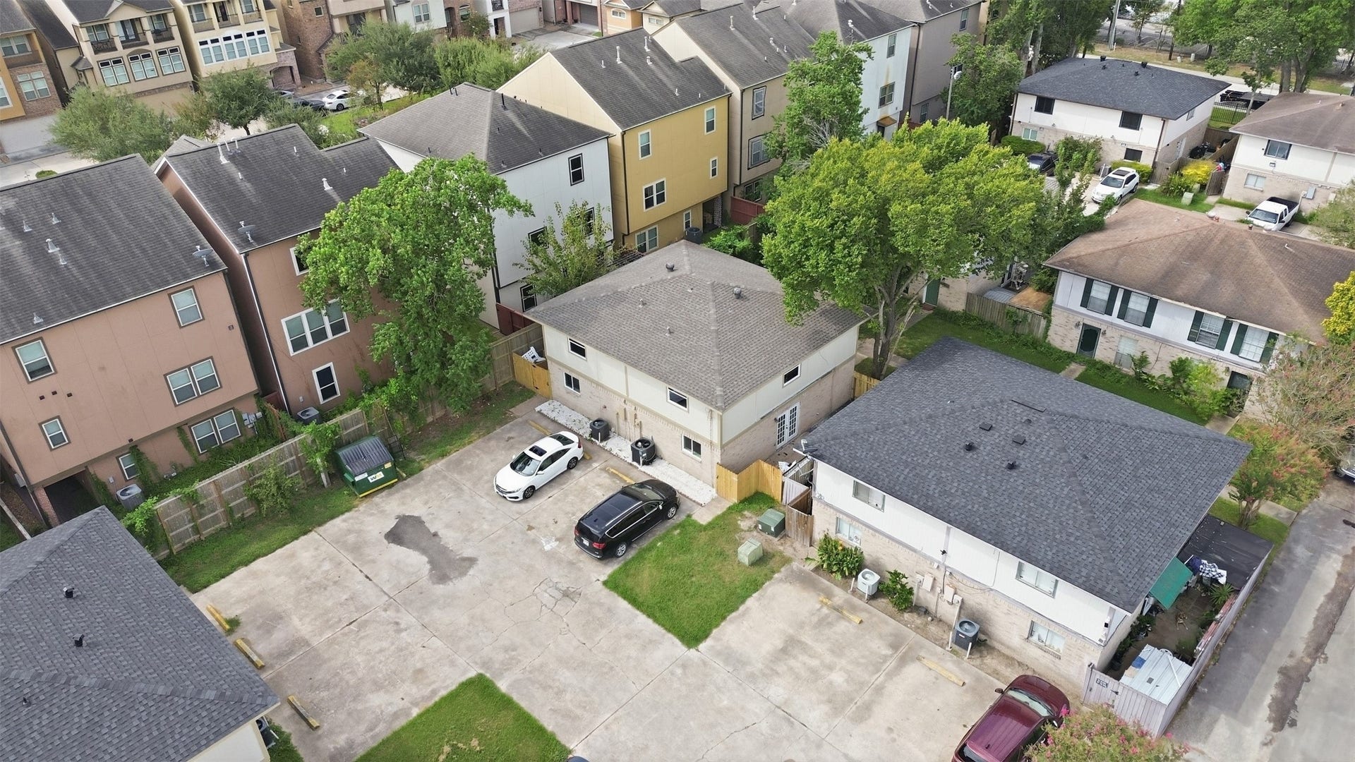 1936 Upland Drive, Houston, TX 77043 Charming residential area featuring a mix of modern and traditional homes, ample parking, and lush greenery providing a serene suburban setting.