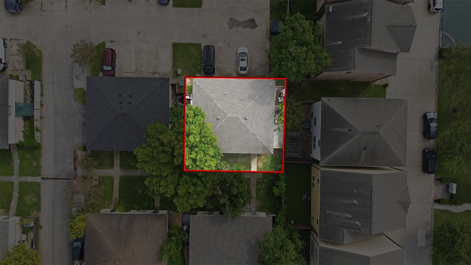 1936 Upland Drive, Houston, TX 77043 Charming home centrally located in a quiet neighborhood, featuring a spacious driveway and lush greenery for privacy.