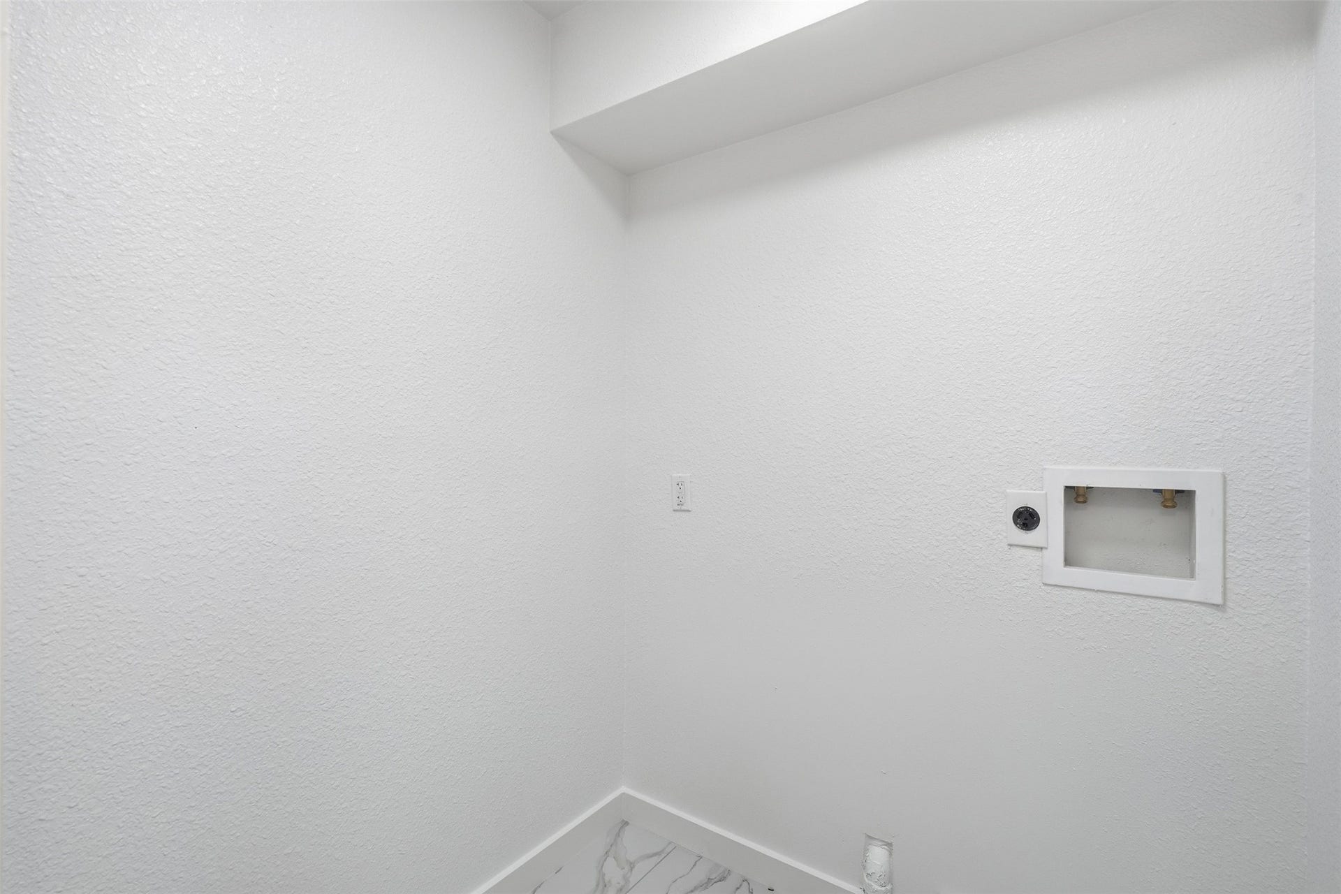 1936 Upland Drive, Houston, TX 77043 Bright utility space with white textured walls, ready for laundry hookups and appliances.